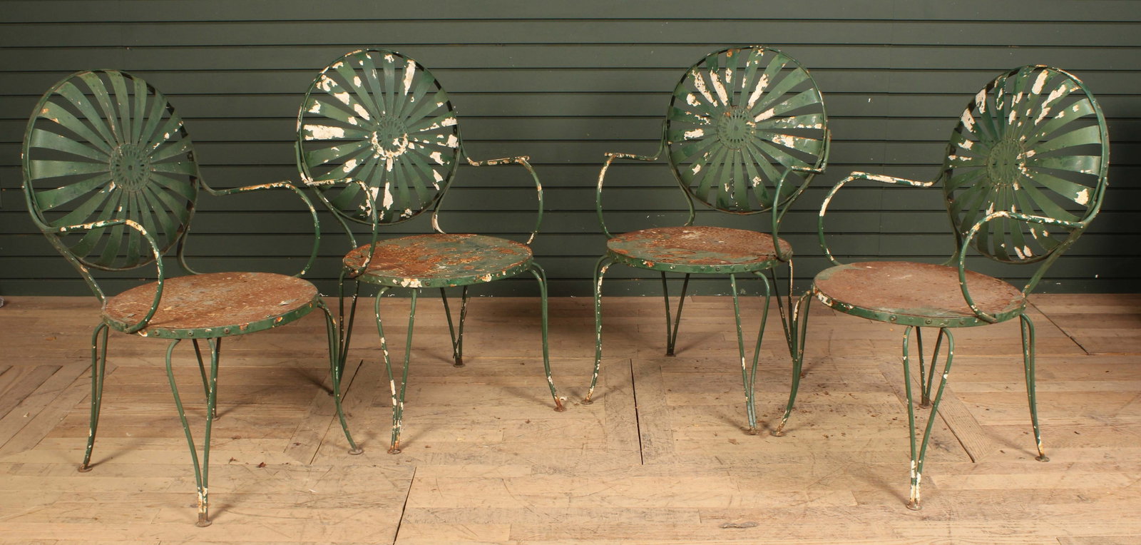 Francois Carre Style Wrought Iron Chairs: Francois Carre Style Wrought Iron garden Chairs, set of 4. Green paint with losses throughout. Size: 35"T x 22"W x 20"D
