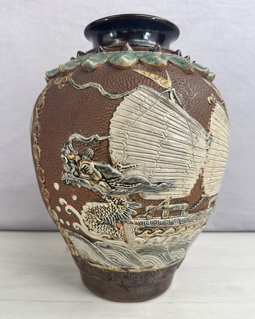 Dragon & Ship Okinawa Tsuboya Style Vase: Urn form Okinawa Tsuboya Yaki style vase, raised dragon and ship design. Signed on bottom. Size: 14.5"T x 9" diameter at widest