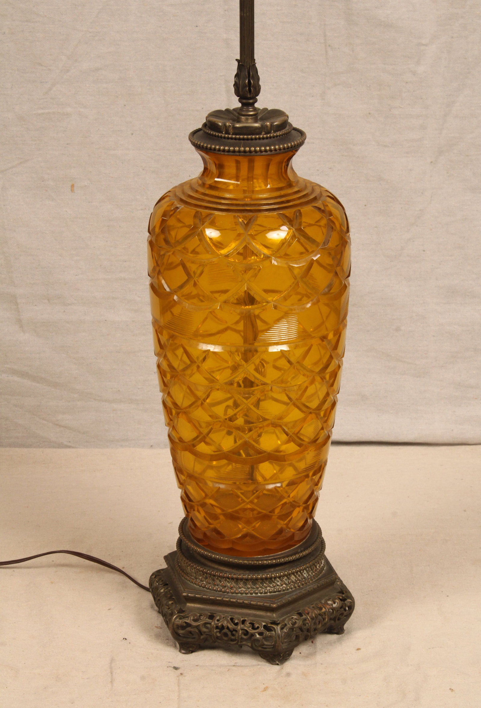 Yellow Brilliant Cut Glass Lamp: Cut glass lamp in yellow, looks amber in the photos but leans more yellow in person, with brass base & fixtures, and internal leaf decoration. Untested. Size: 30.5"H x 8"W x 8"D