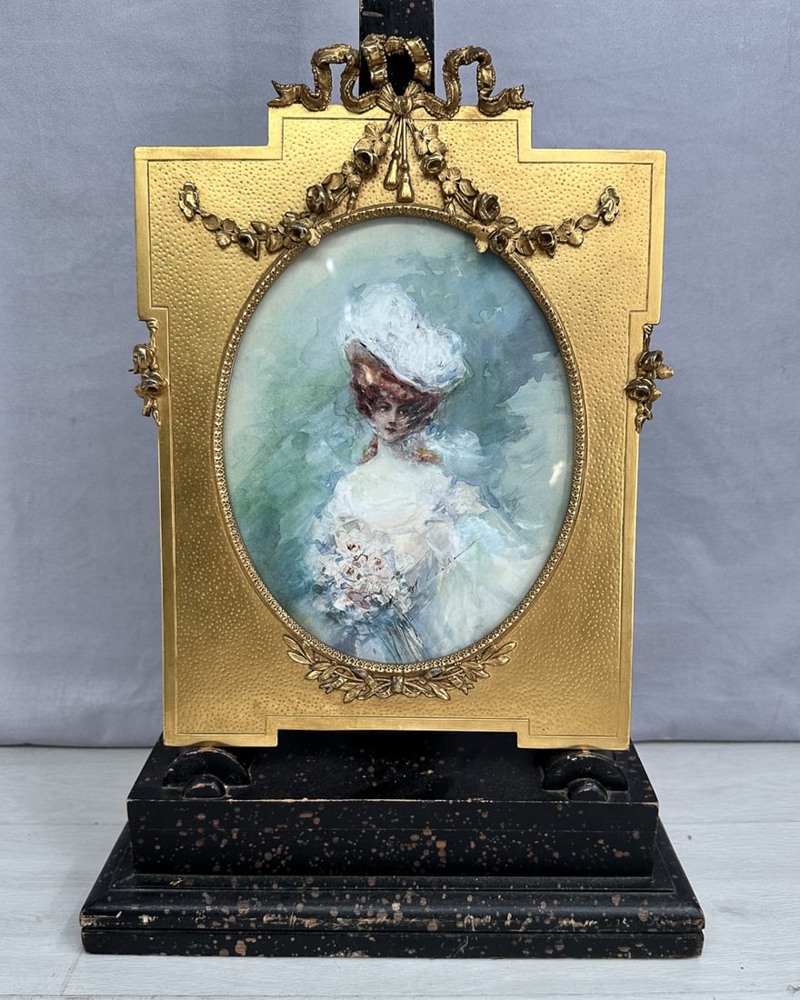 19th C Water Color Portrait: Water color portrait of a lady in gilt frame with floral appliques and accents. Some losses to flowers around frame. Unsigned. Size: 15"T x 11"W