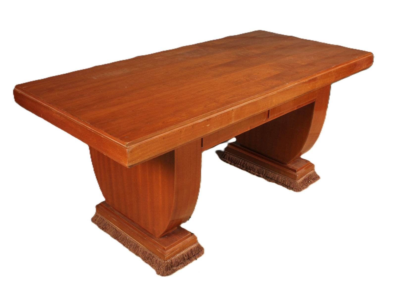 French Art Deco Desk, IMO Andre Arbus: French art deco style desk, IMO Andre Arbus. Desk breaks down into 3 pieces for transport. Fringe detail on the base on the stylized legs. 2 drawers. Some wear to edges of desk top and bases of suppor