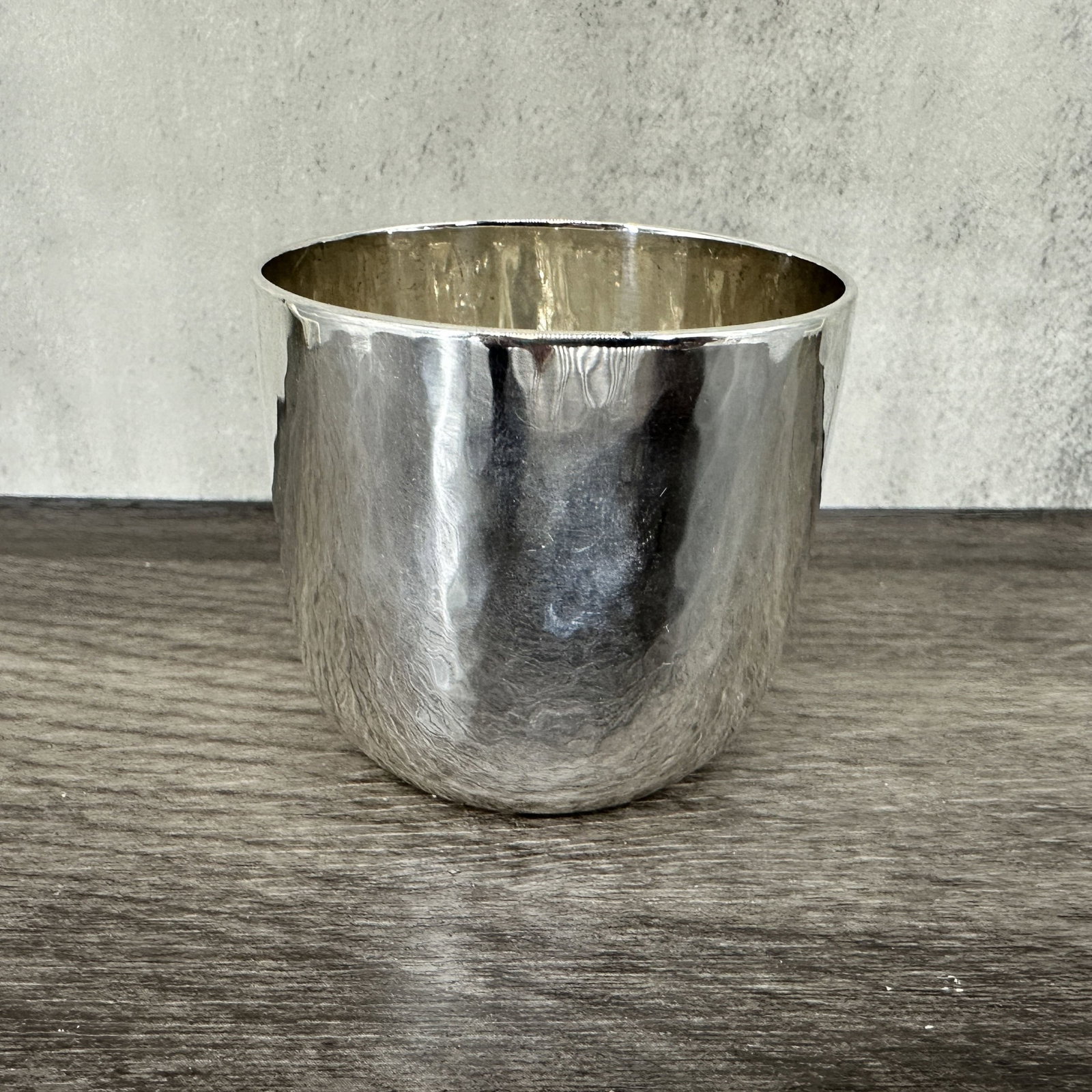 Silver Hammered Cup: Diminutive hammered sterling silver cup. Stamped on underside, Shreve, Gump & Low Co. Size: 1.75"T x 2" diameter, 70.4g