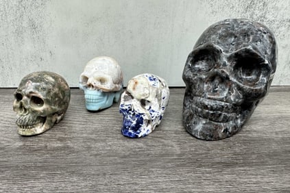 4 Skulls Carved From Stone