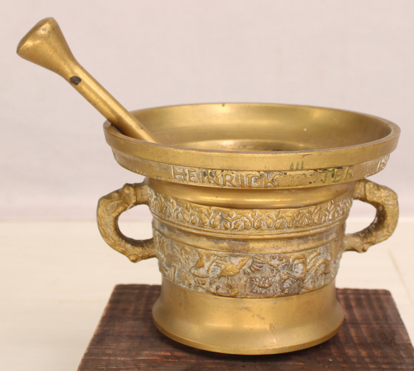 Dutch Bronze Apothecary Mortar: Bronze apothecary mortar & pestle with latin inscription: Heinrick Ter Herst Me Fecit Anno 1607. Translation Heinrich Ter Herst Made Me In 1607. Size: mortar 5"H x 7" Dia pestle 9.5"