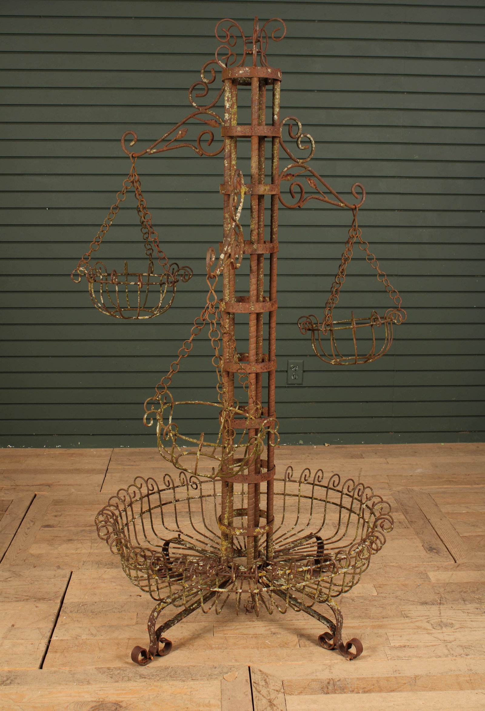 Great scale plant stand with multiple hanging baskets and a generous space at the bottom for: Great scale plant stand with multiple hanging baskets and a generous space at the bottom for potted plants. Size: 66"T x 34" diameter base