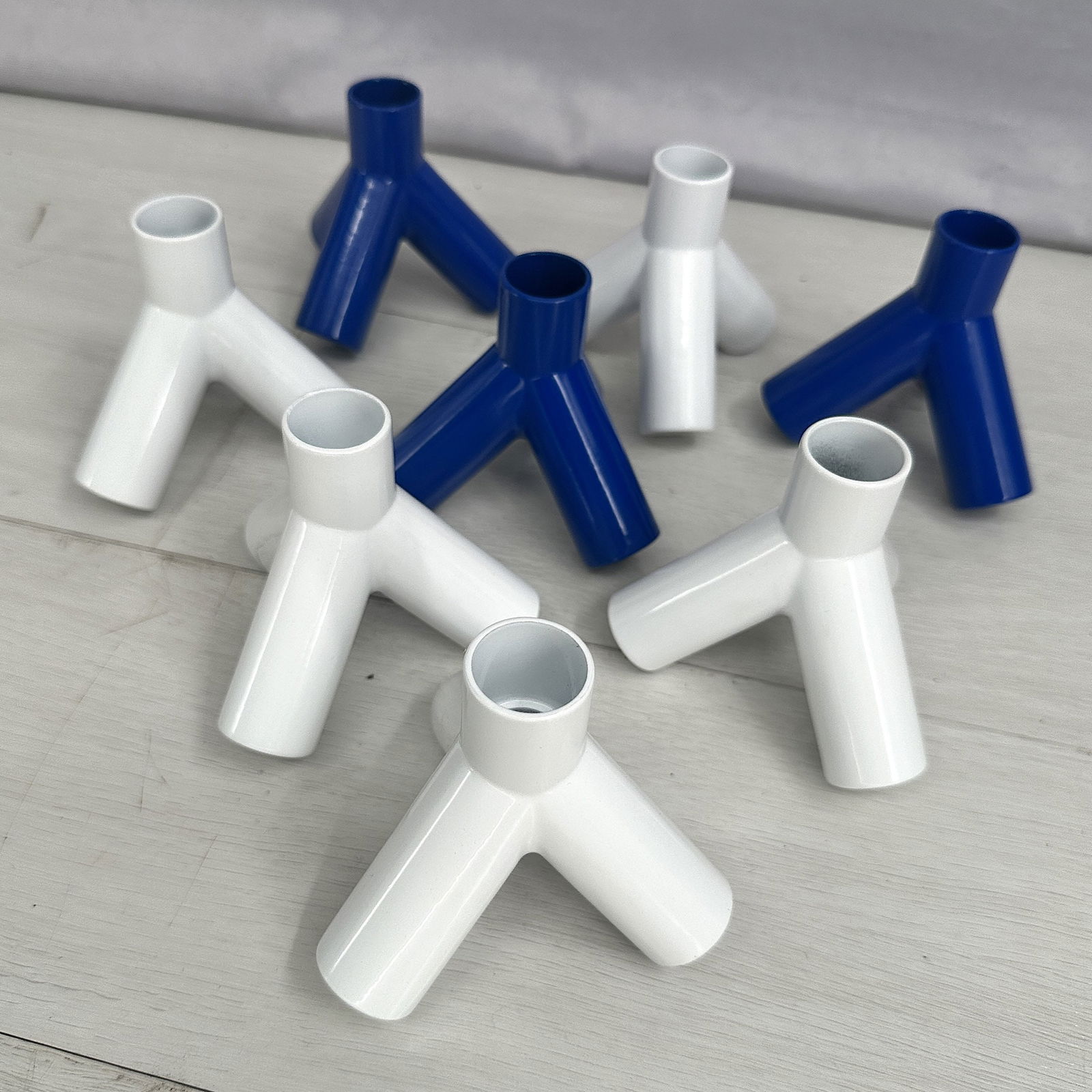 8 candlesticks from Design by Conran, blue and white powder coated metal, stamped on bottom. Size:: 8 candlesticks from Design by Conran, blue and white powder coated metal, stamped on bottom. Size: 3.5"T x 3.75"L x 4" D each