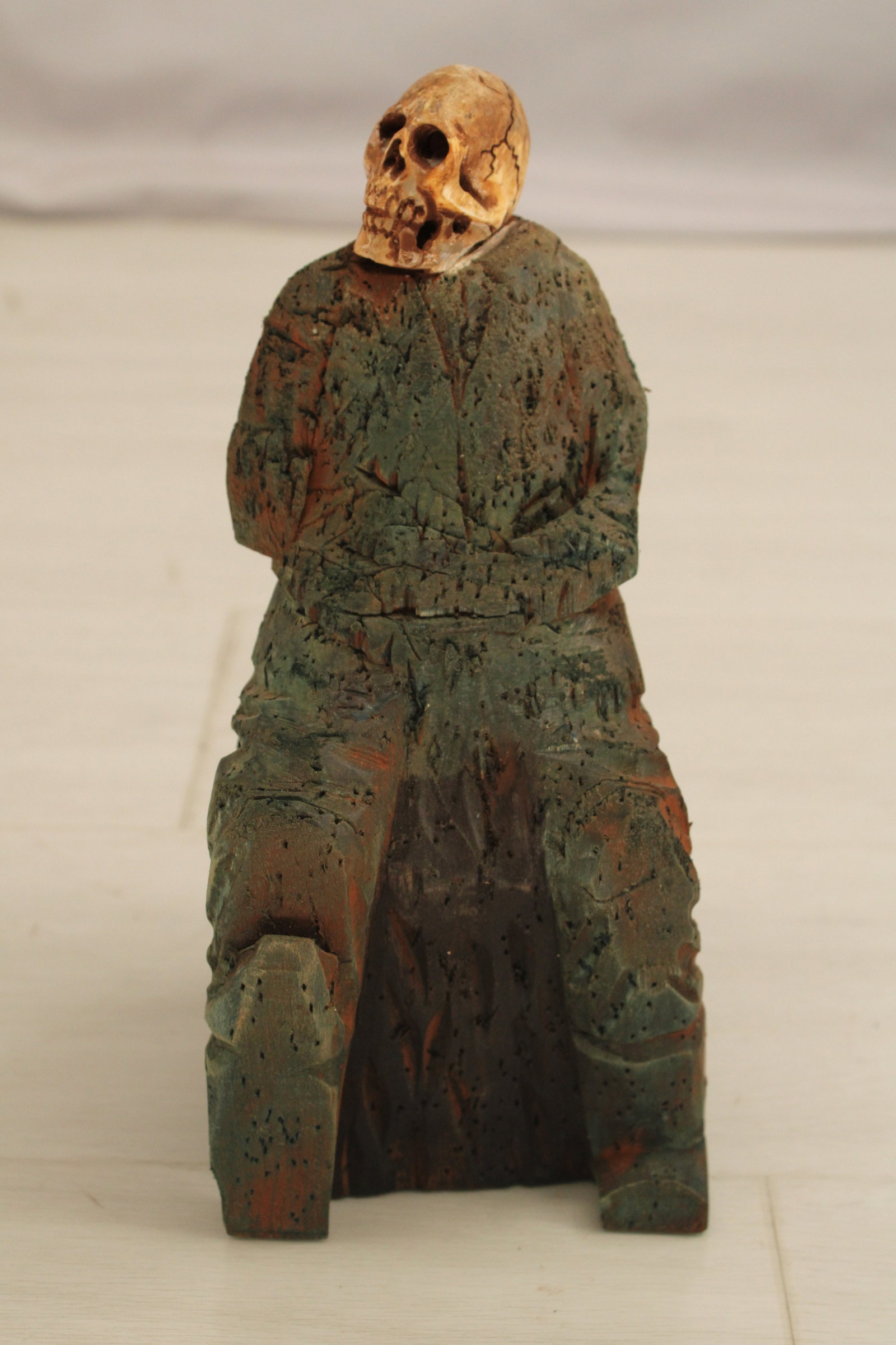 Human Figural Effigy, Santos: Aged and weathered carved wood human form with skull head. Provenance: De-accessioned from a private museum whose collection was curated through the years to include acquisitions from David Guest (a o