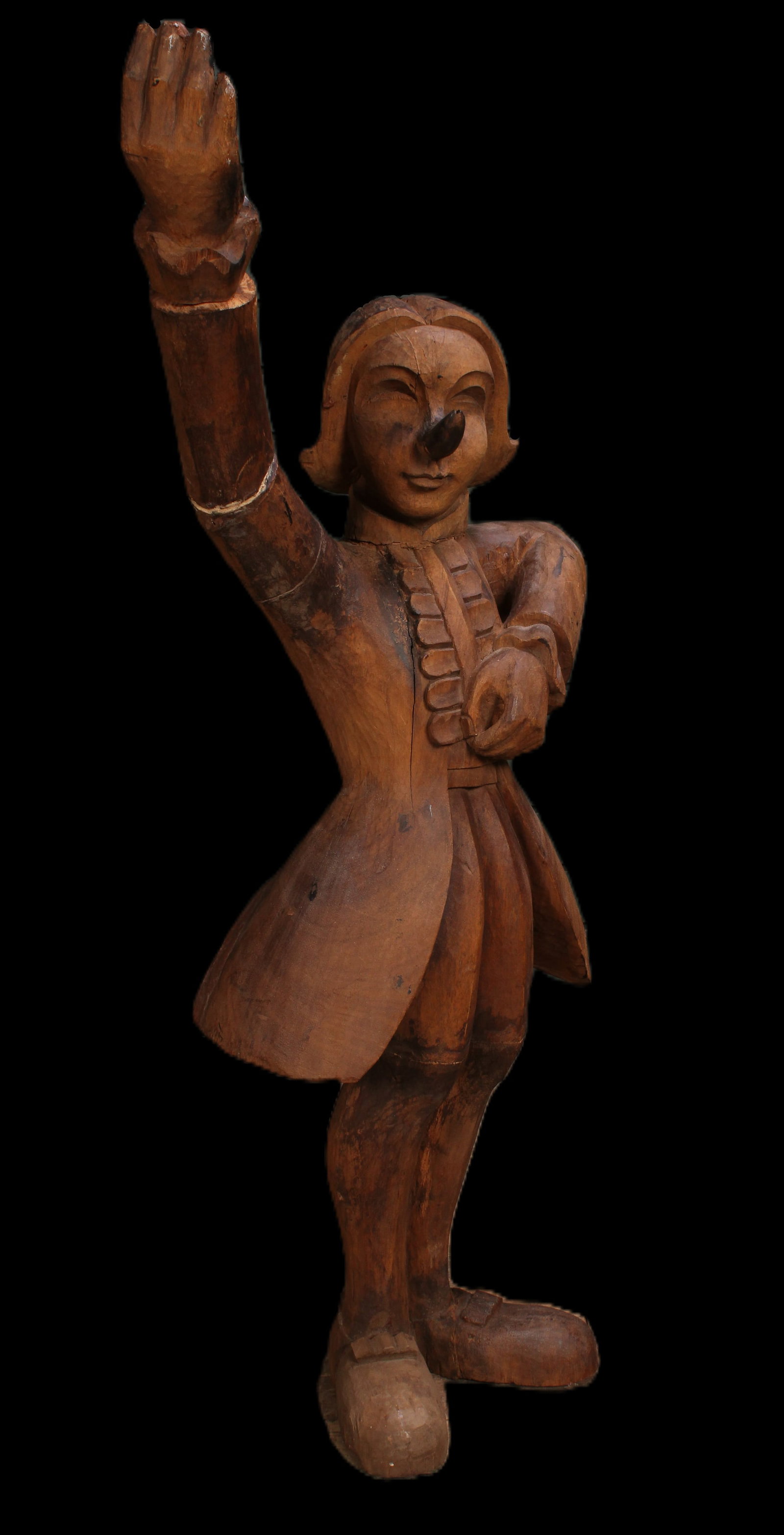 Continental Figural Carved Wood Minstrel, 42": Continental Figural Carved Wood Minstrel. Figure resembling Pinocchio wear 18th C garb poised to sing to the court. Size: 42.5" H x 22" W x 12" D