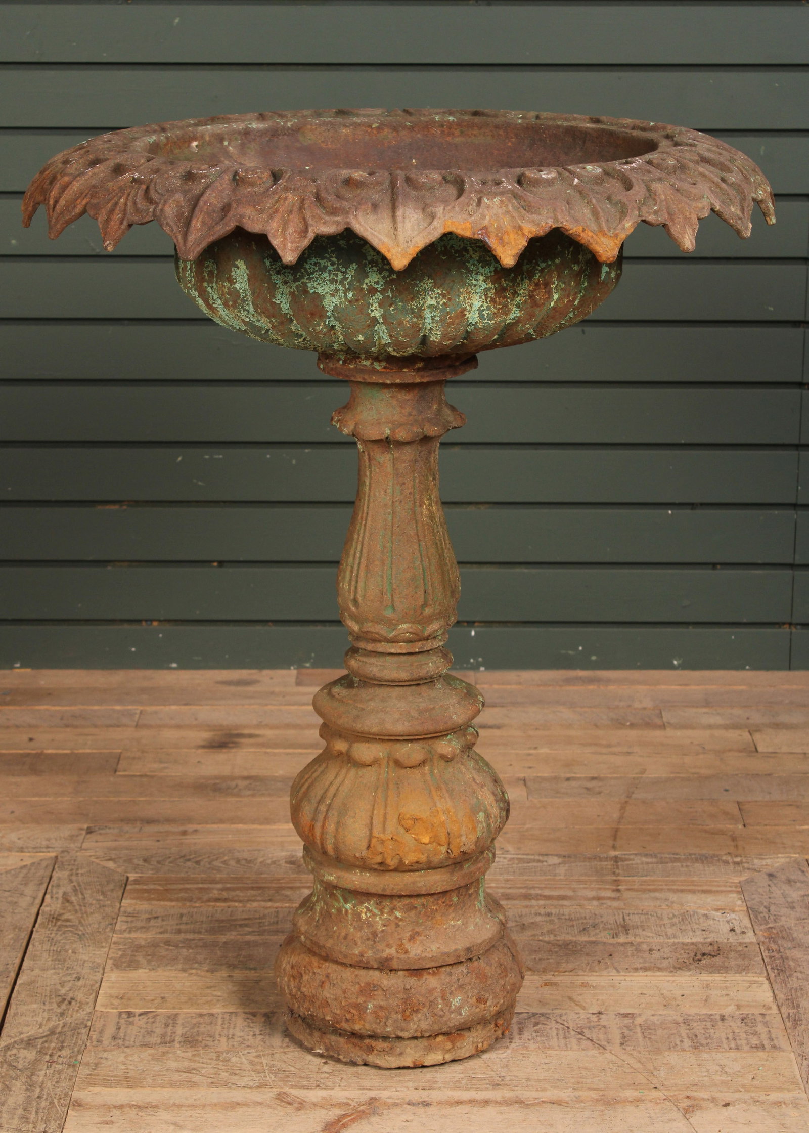 Cast Iron Urn With Pedestal: Late 19th Century possibly Fiske cast iron garden urn with stylized floral rim over decorated bowl all supported on column base. Size: 31"T x 24" diameter