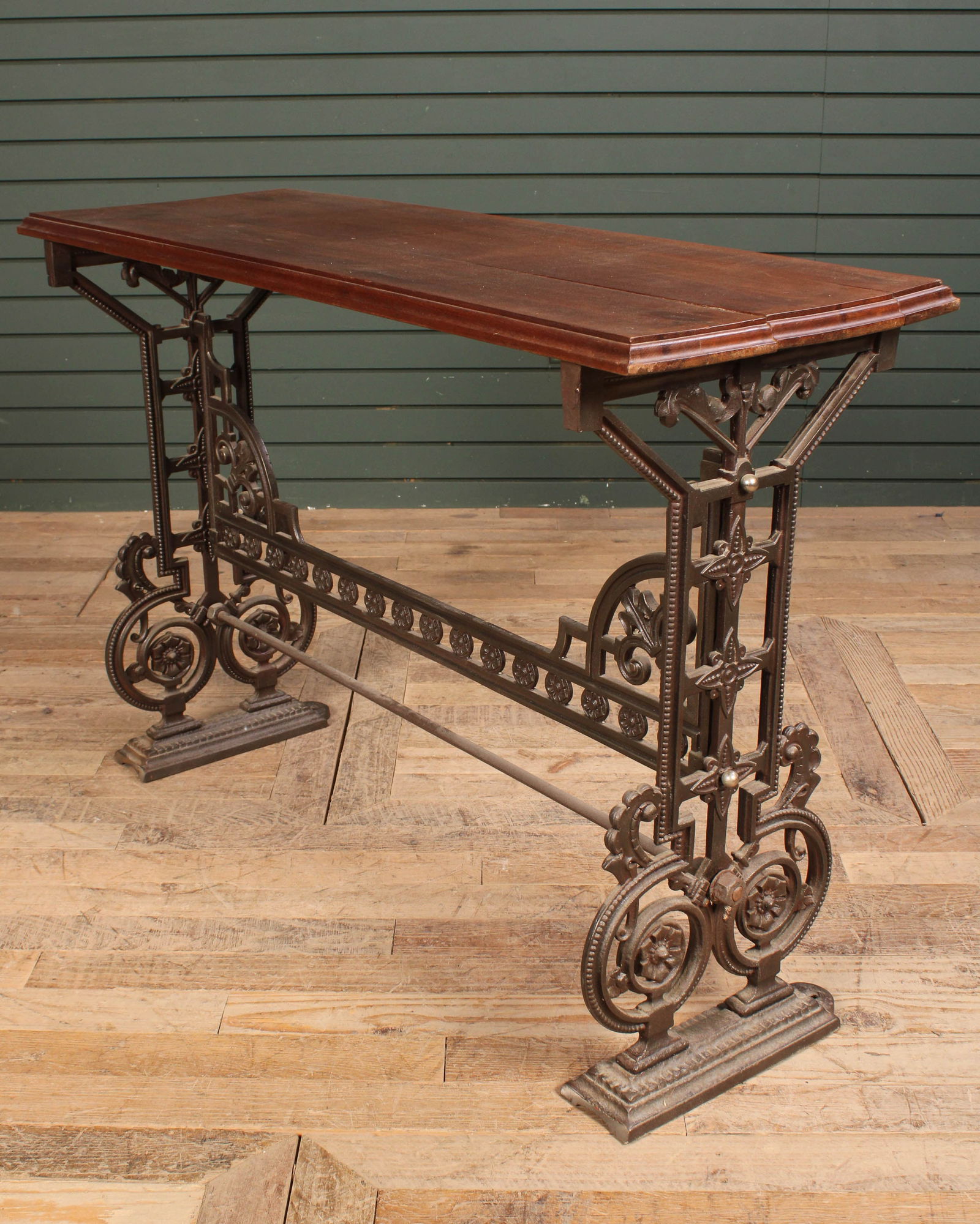 Cast Iron & Wood Console Table: Christopher dresser style cast iron garden or conservatory console table having a late wood top over stylized cast iron base. Size: 30"T x 43"L x 15.75"W
