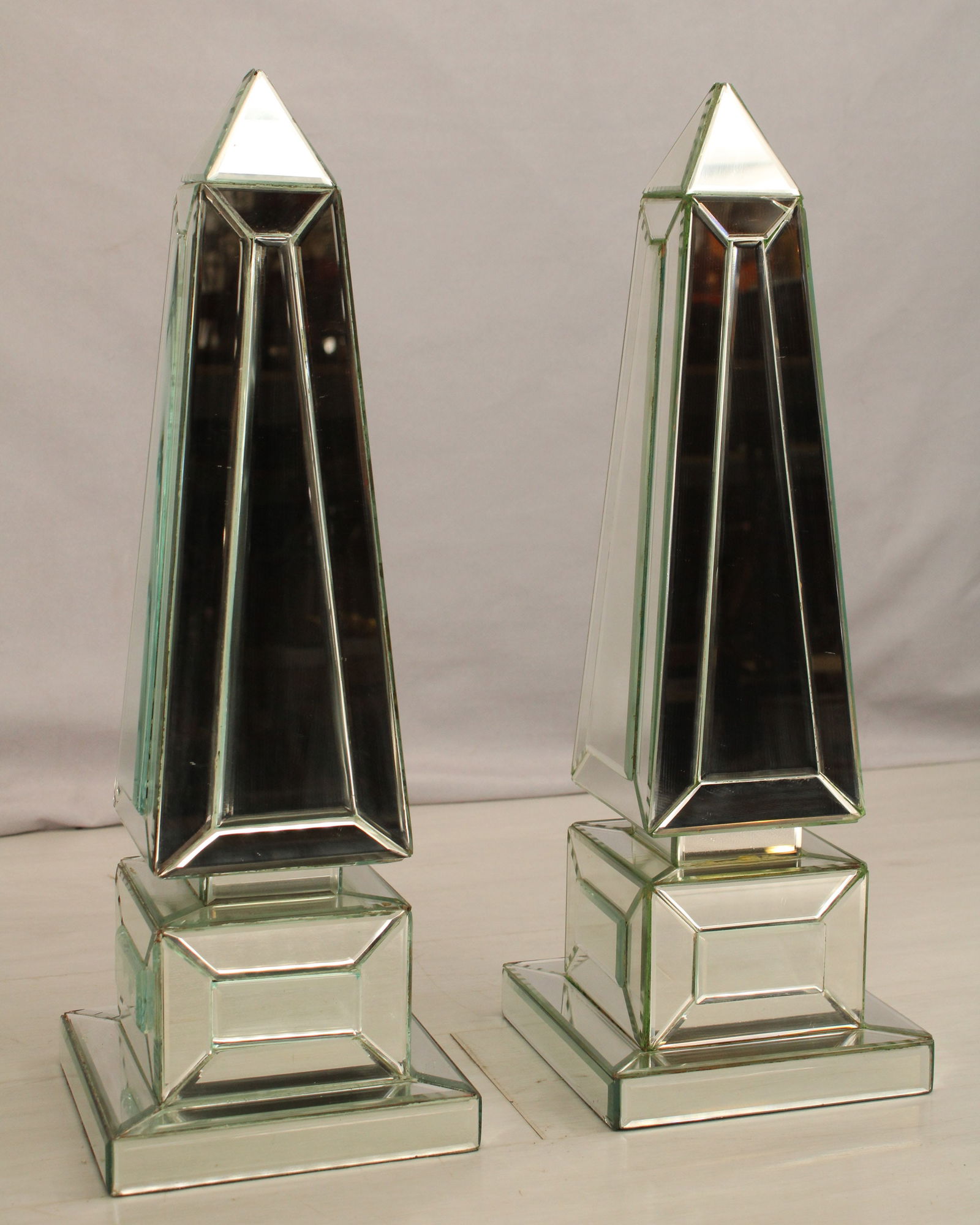 Mirrored Obelisks: Mirrored obelisk set. The Egyption representation of a frozen ray of sunlight. Size: 19.75"T x 6.75" square base