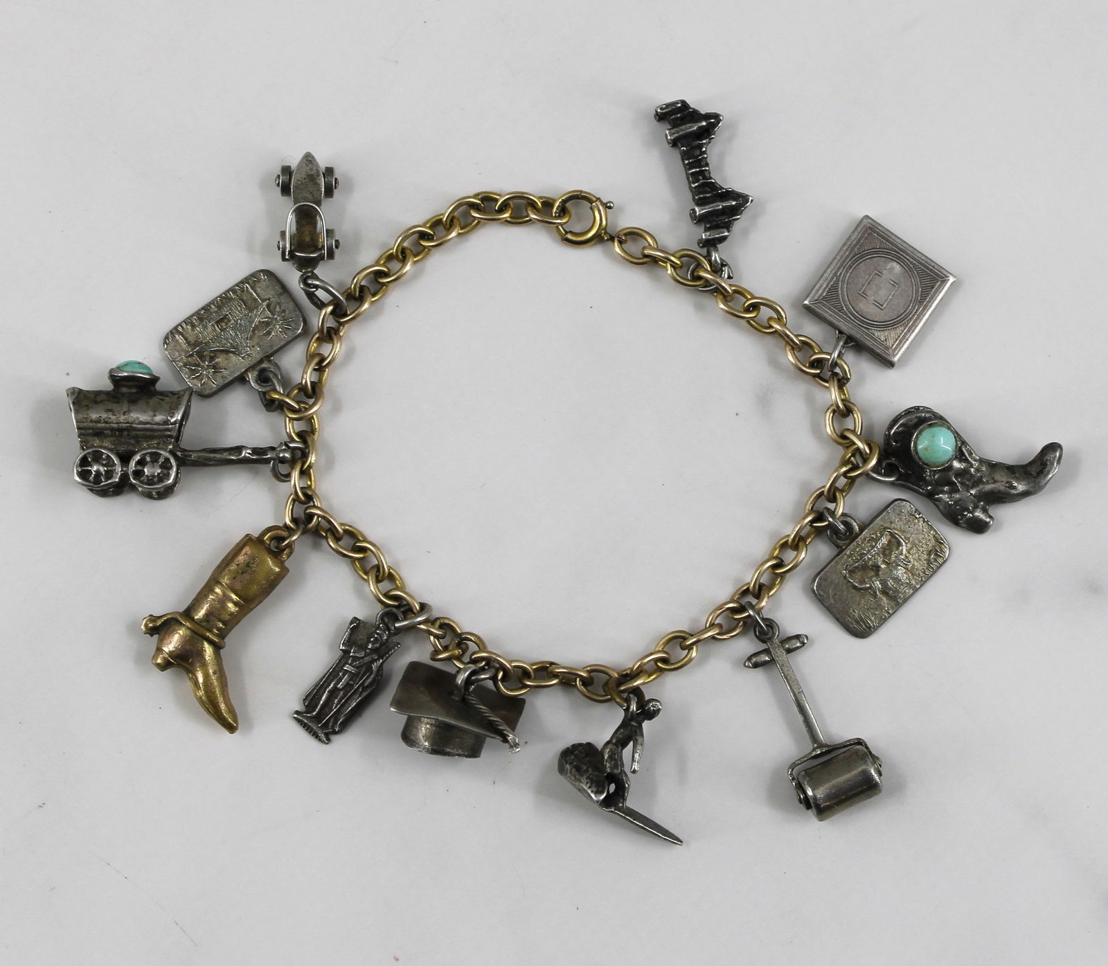 Silver and Brass Charm Bracelet (1 of 7)