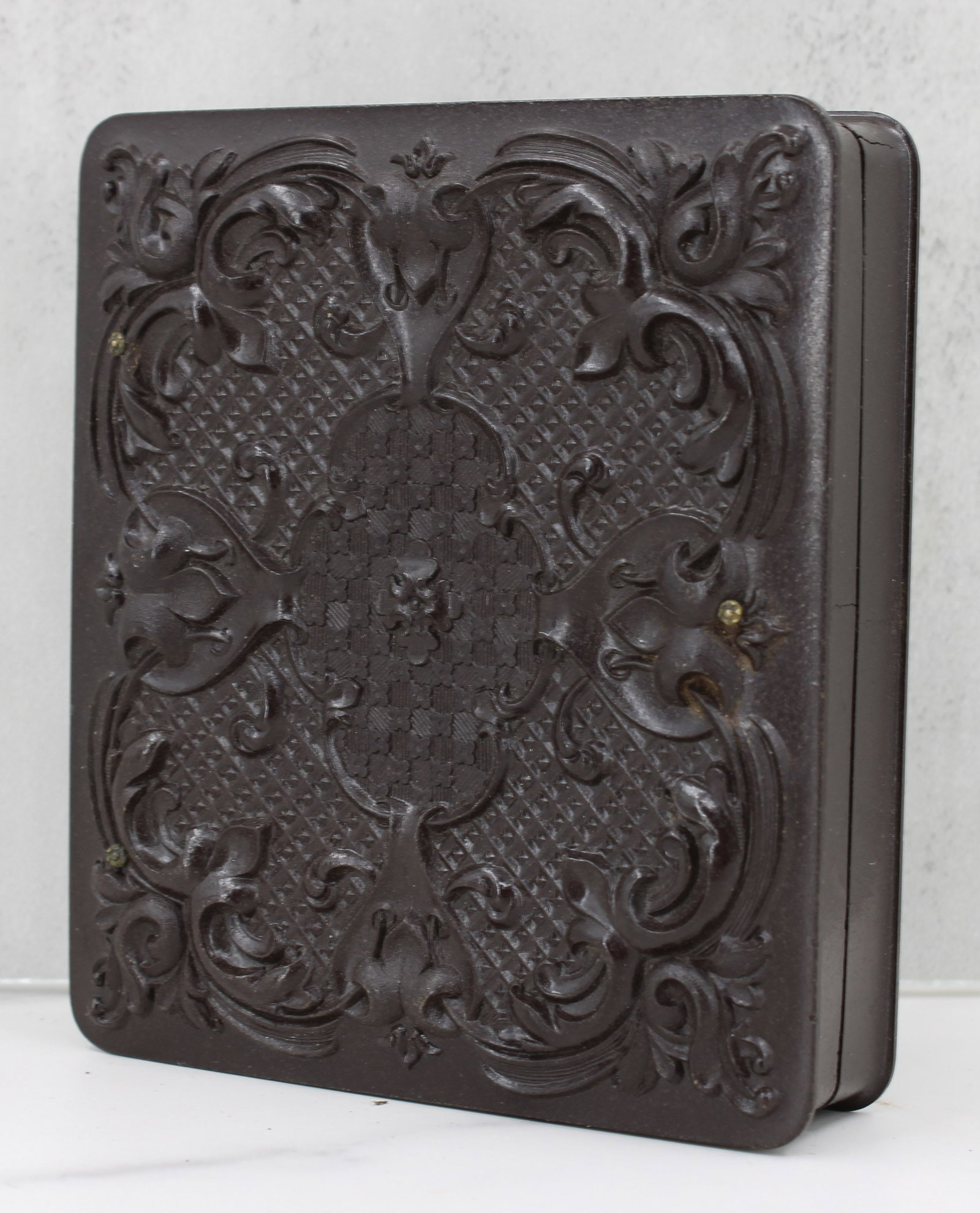 Ambrotype of a Women in Plaid: Exception ambrotype of a women in plaid. Case, lining and photo in excellent condition, quarter plate size. Gutta percha case with beautiful filigree. Approximately 1855-1865. Size: 3.75"T x 3.25"W x 