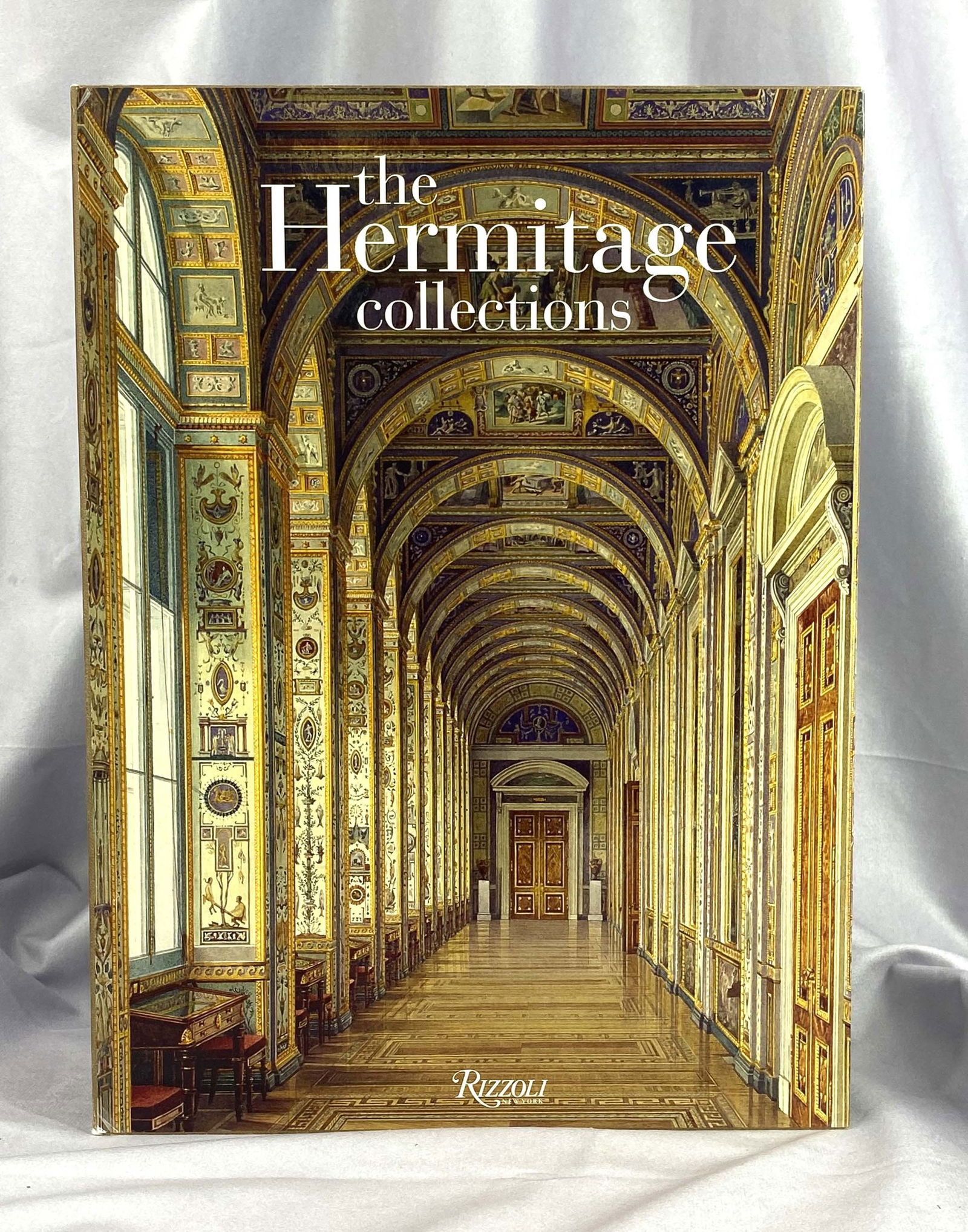 The Heritage Collection, Coffee Table Book: Two volume coffee table book set in original sleeve, showcasing the works of the Hermitage Collection. Each volume has over 250 color photos. Fist printing, from Rizzoli. Size: 13.5"T x 10"W x 3"D