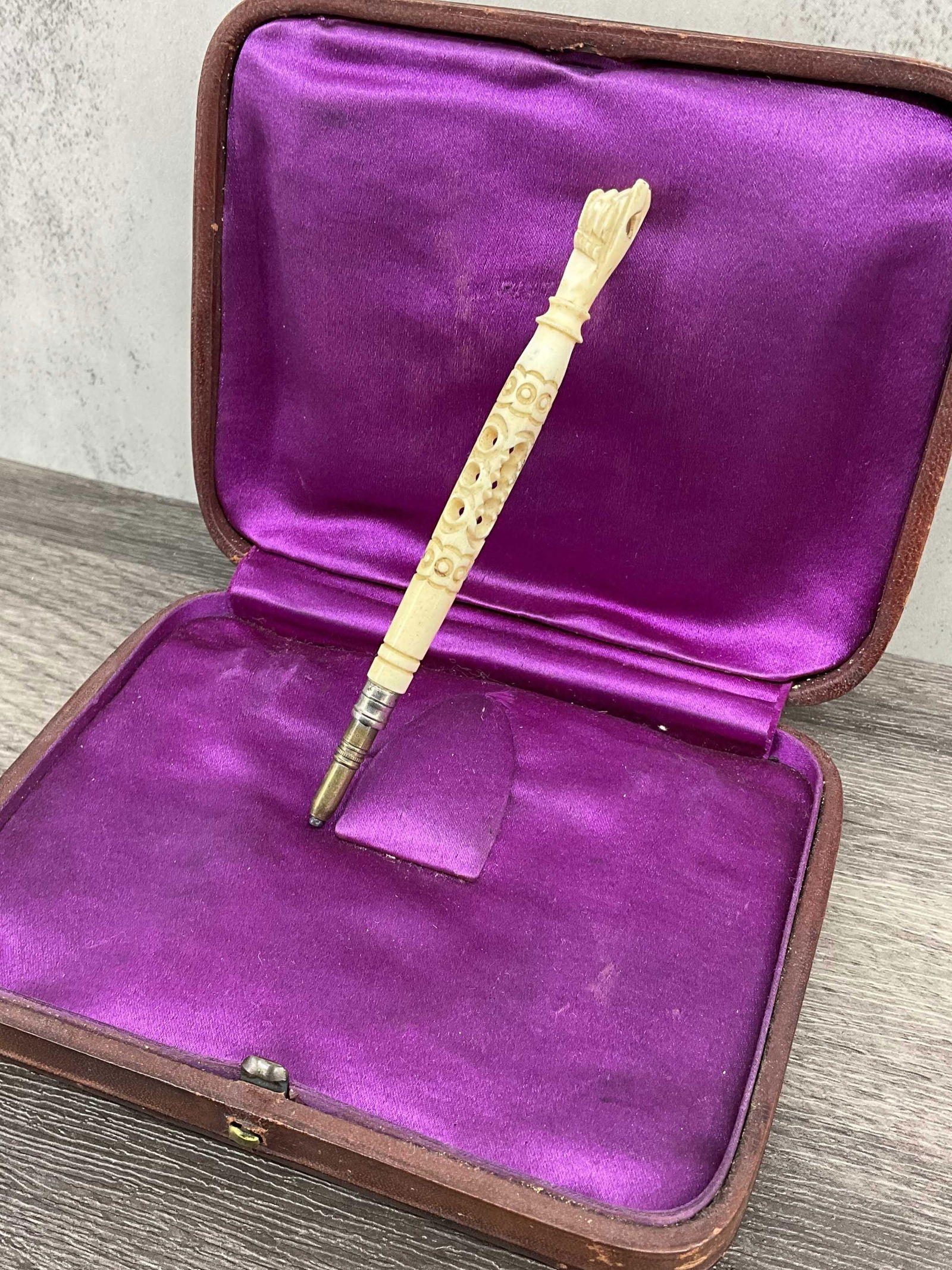 Antique Spanish Carved Bone Pencil with Stanhope: Very interesting souvenir piece, a carved bone mechanical pencil with central carved opening, a figa shaped end with stanhope and a functional pencil. The pencil lead does still write, so this is a fu