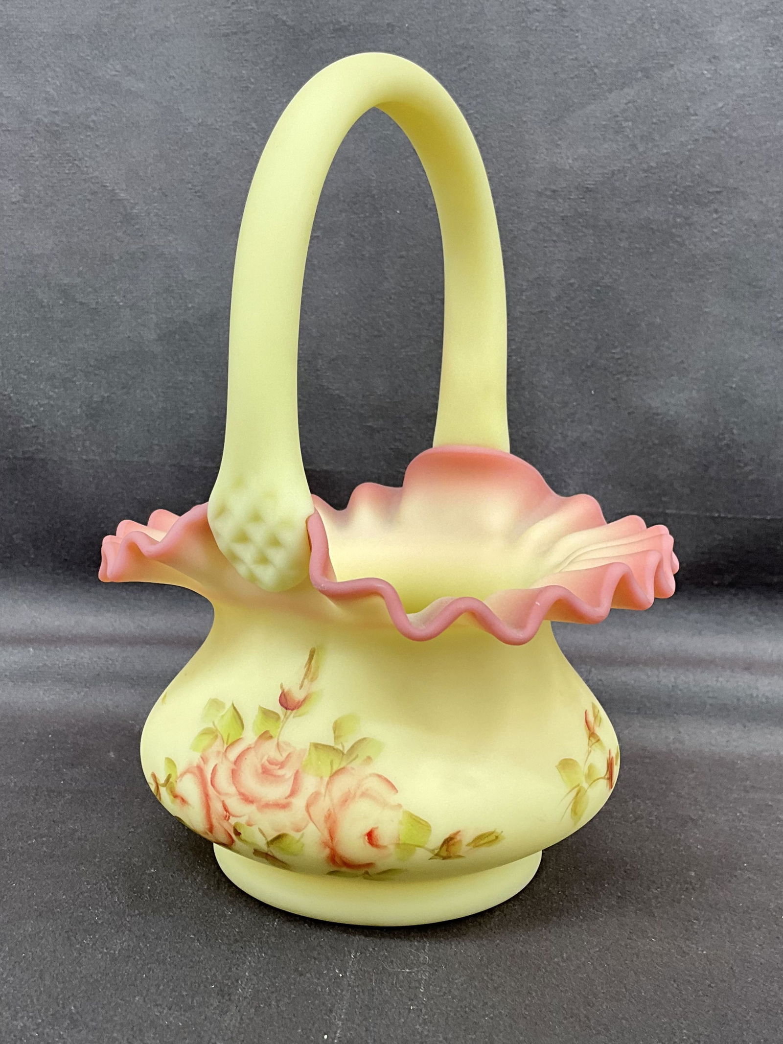 Fenton Uranium Glass Basket, Signed: Uranium, UV reactive, green and pink custard glass basket, pie crust edge, hand painted floral design. Signed on underside, J. Hoffman. Size: 7.25"T x 5"W x 5.25"D