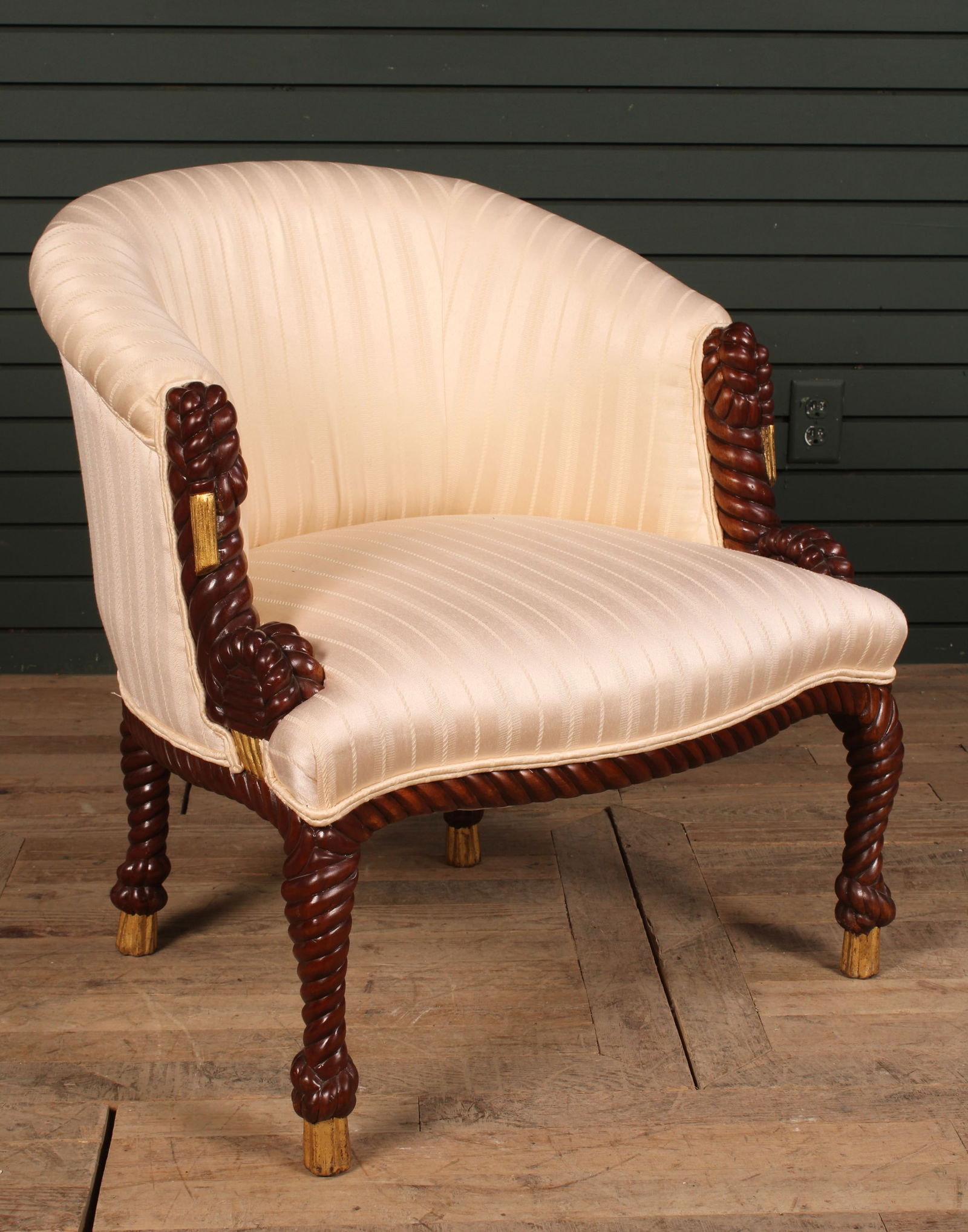 Carved Tassel Motif Upholstered Chair: A carved rope twist decorated bergere having barrel back and shaped seat. Size: 30"H x 27"W x 22"D