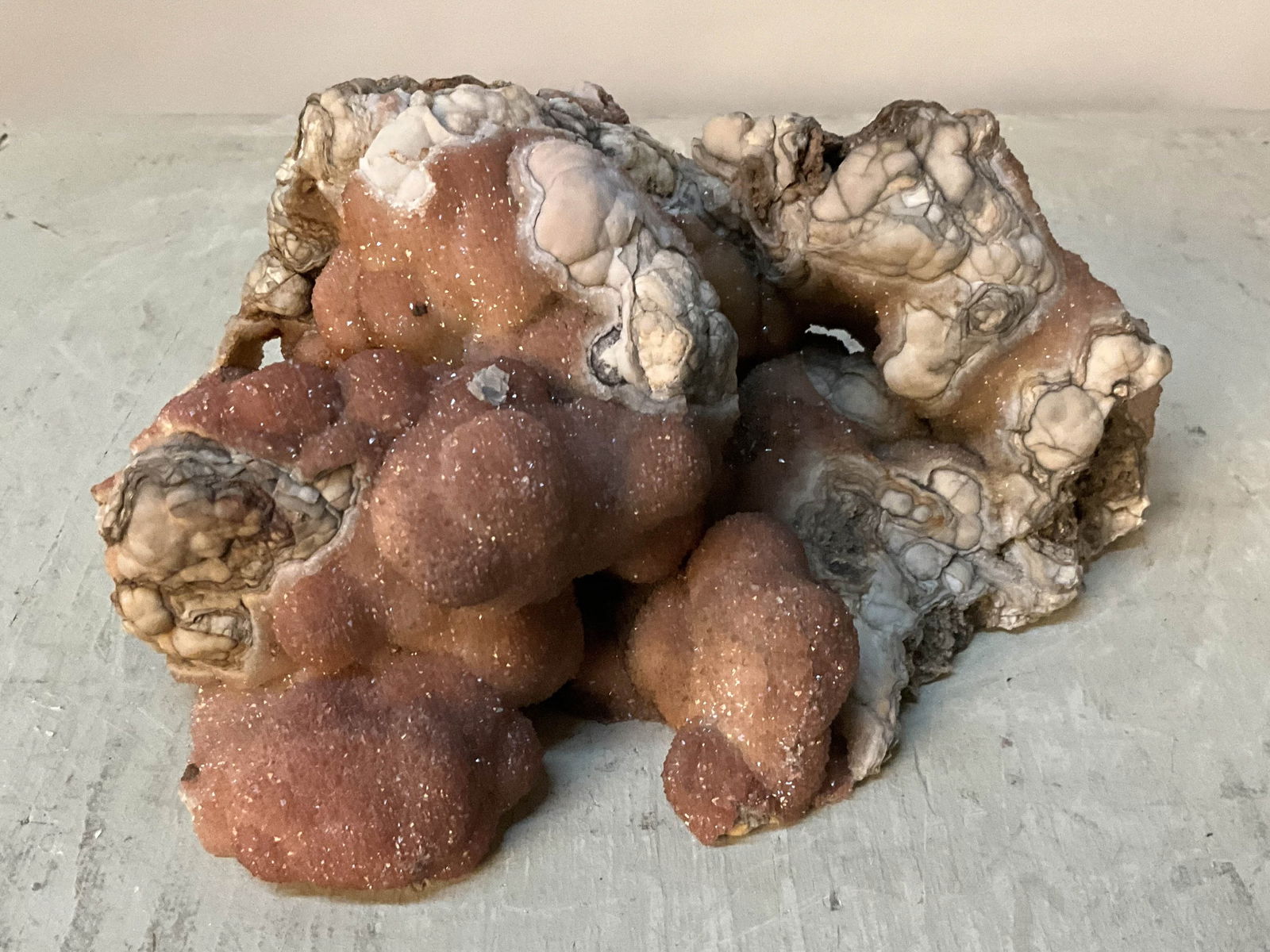 Rose Quartz Druzy, Free Form: Interesting free form druzy specimen in rose quartz, flat bottom, Missouri. Size: 4.5"T x 10"L x 7"D irregular Provenance: From the lifetime collection of an Orland, Pennsylvania private estate.