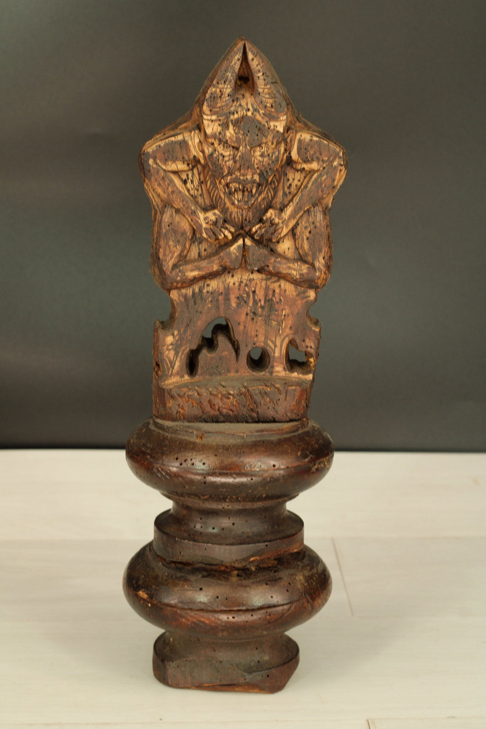 Baphomet Fetish, Altar Adornment: Carved wood baphomet cabinet statue on turned base. Size: 14" H on 4.5"Dia base. Provenance: De-accessioned from a private museum whose collection was curated through the years to include acquisitions