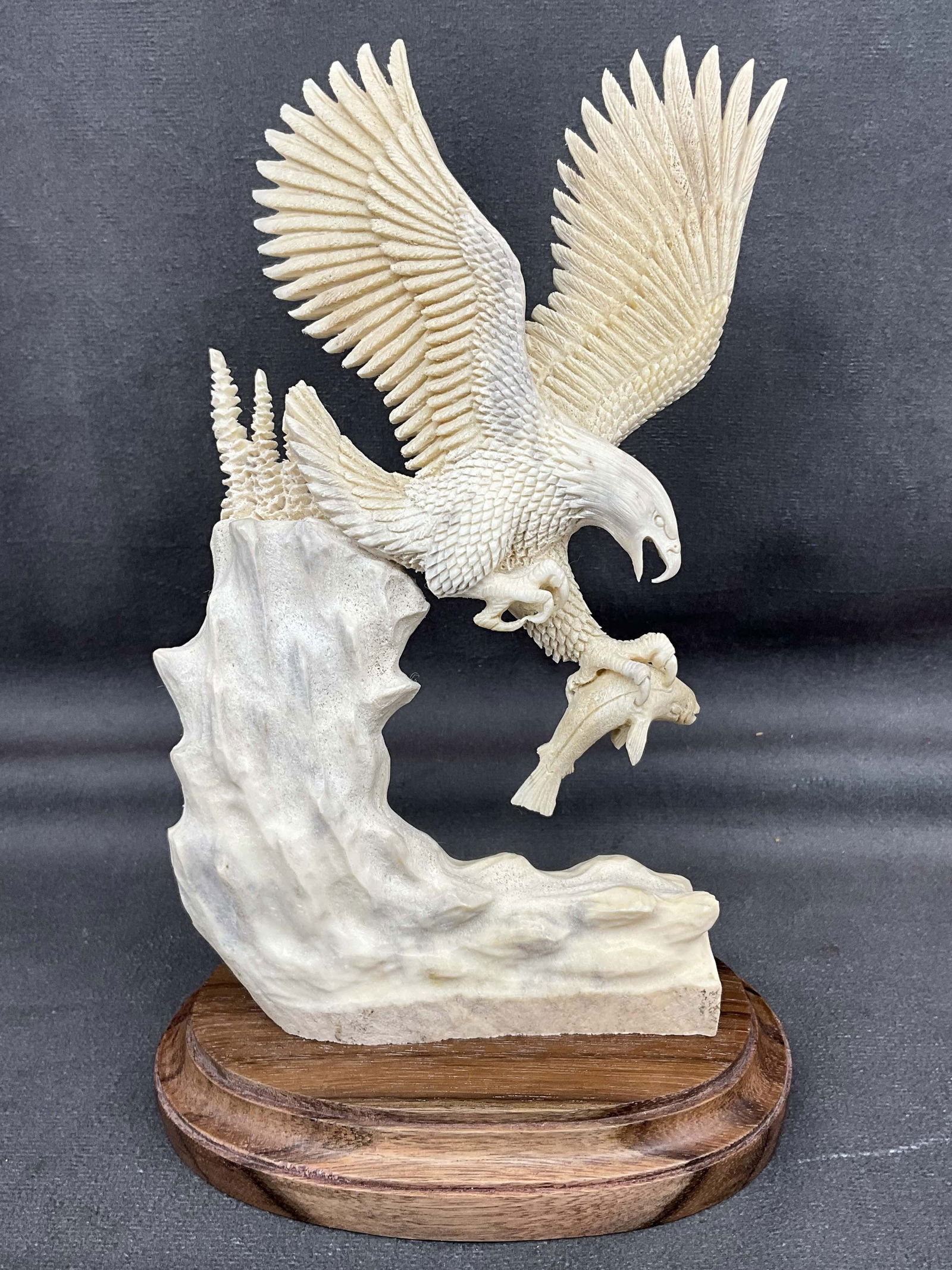 Eagle With Fish Bone Carving: Great scale carved bone eagle and fish, custom wood base. Bone Size: 8"T x 5.5"W x 3"D Provenance: From the lifetime collection of an Orland, Pennsylvania private estate.