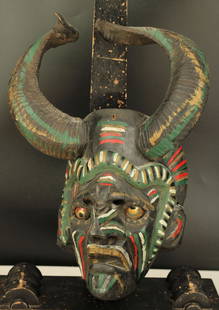 Vintage Guatemalan Horned Festival Mask: Guatemalan diablo festival dance mask. Painted with glass eyes and attached horns. Size: 14.5"H x 10"W x 7"D