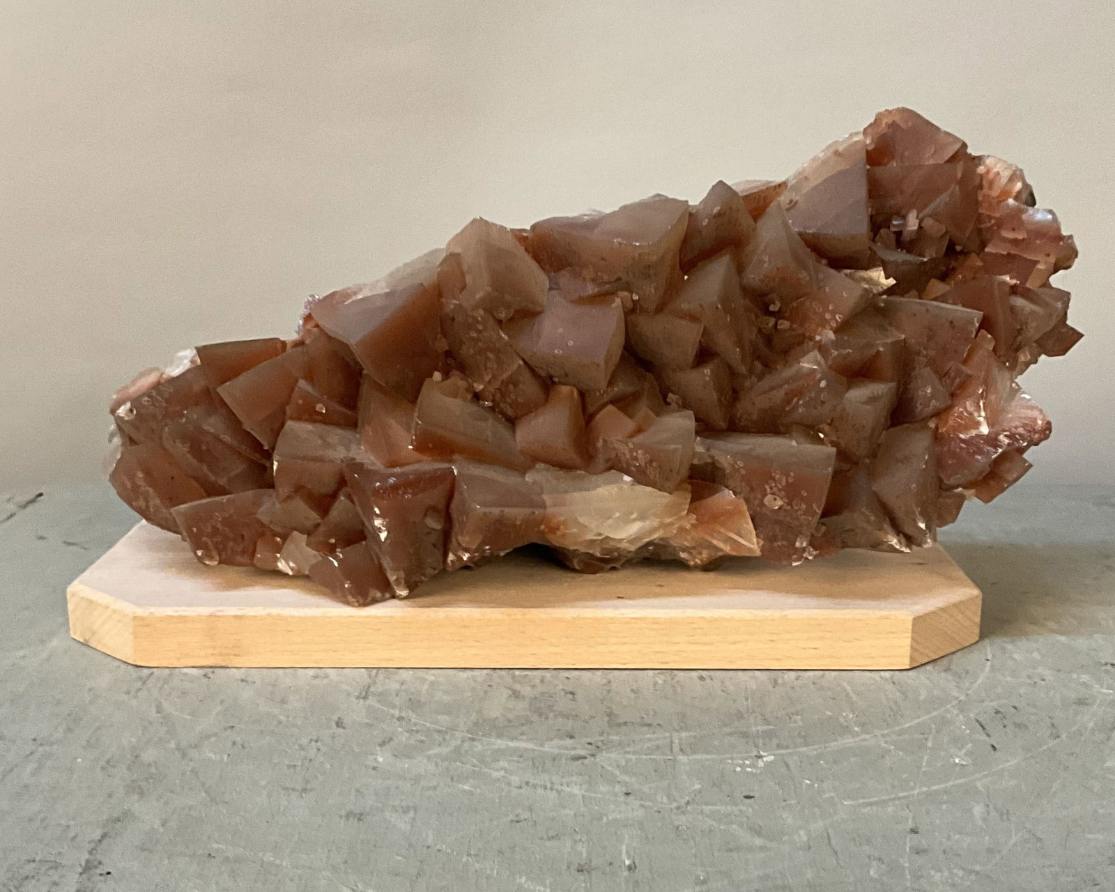 Large Dog Tooth Calcite On Stand: Dog tooth calcite on wood plinth, large crystal formation, deeply colored. Natural. Size: 6"T x 12.5"L x 7.5"D without stand Provenance: From the lifetime collection of an Oreland, Pennsylvania privat