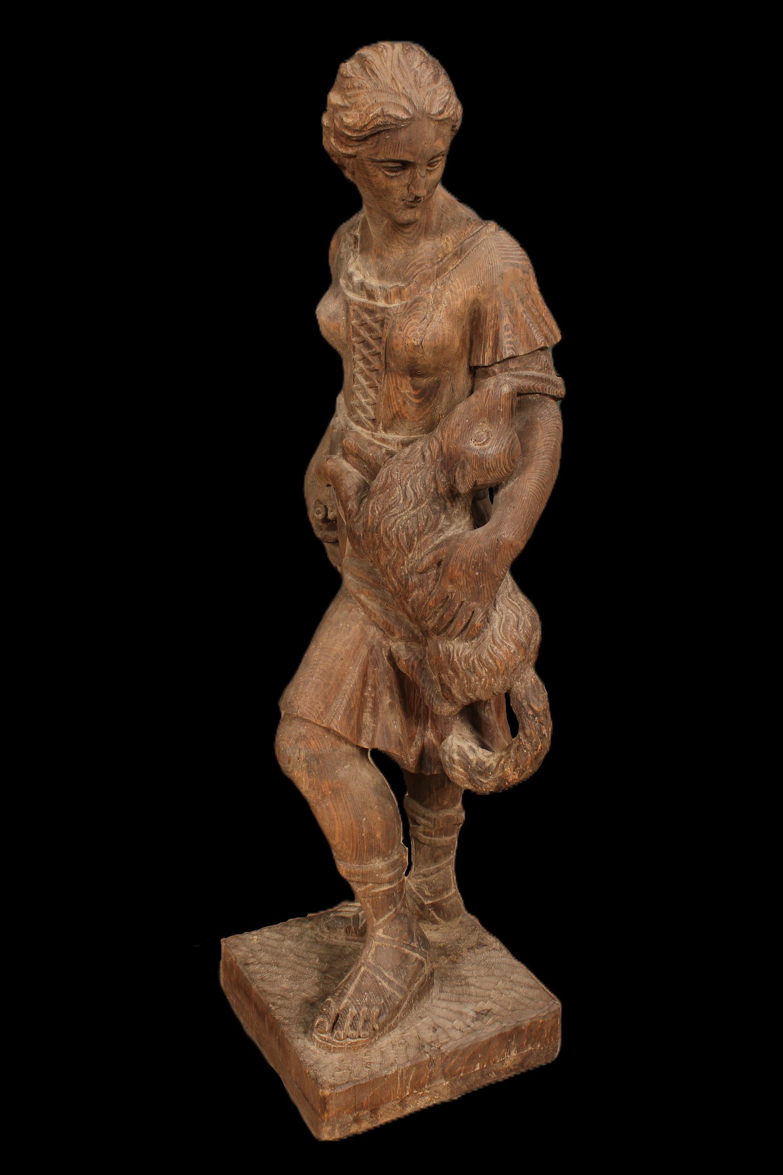 Continental Carved Wood Conservatory Figure: A good Continental carved wood female figure with a corset dress and animal companion. Size: 40"H x 17"W x 15"D