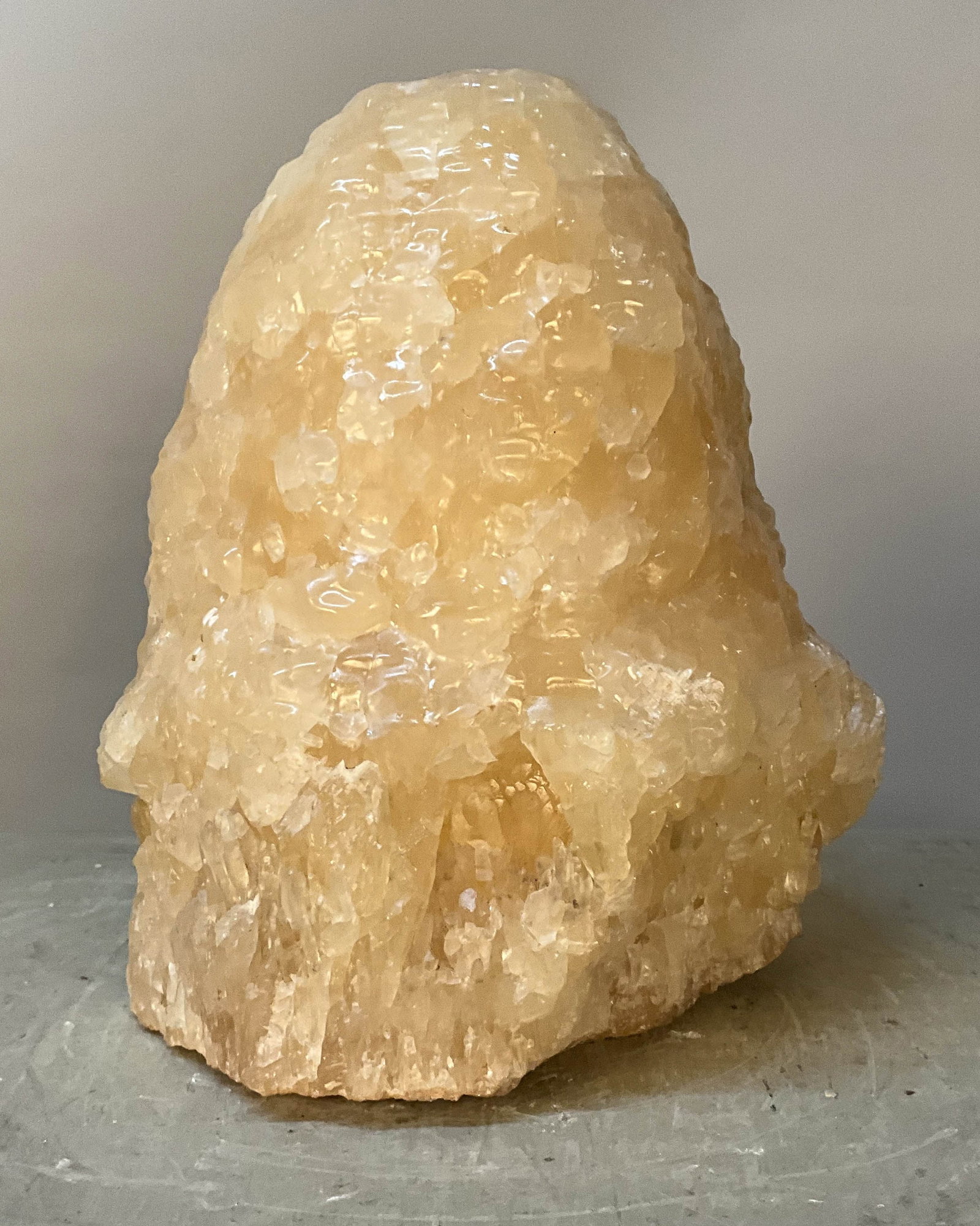 Honey Calcite, Natural Beehive Form: Stunning natural calcite formation, honey colored and looks like a beehive. Size: 12"T x 8"L x 8.5"D Provenance: From the lifetime collection of an Oreland, Pennsylvania private estate.