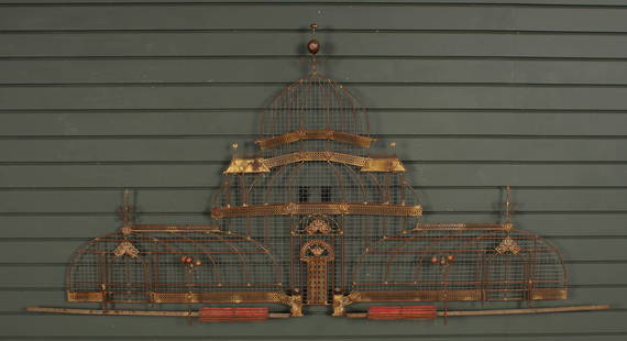 Curtis Jere Wall Sculpture: A gilt copper and mixed metal wall sculpture of a conservatory building with park benches, lamp posts, and architectural embellishments, by Curtis Jeré (American, 1963-2008), signed on the upper righ