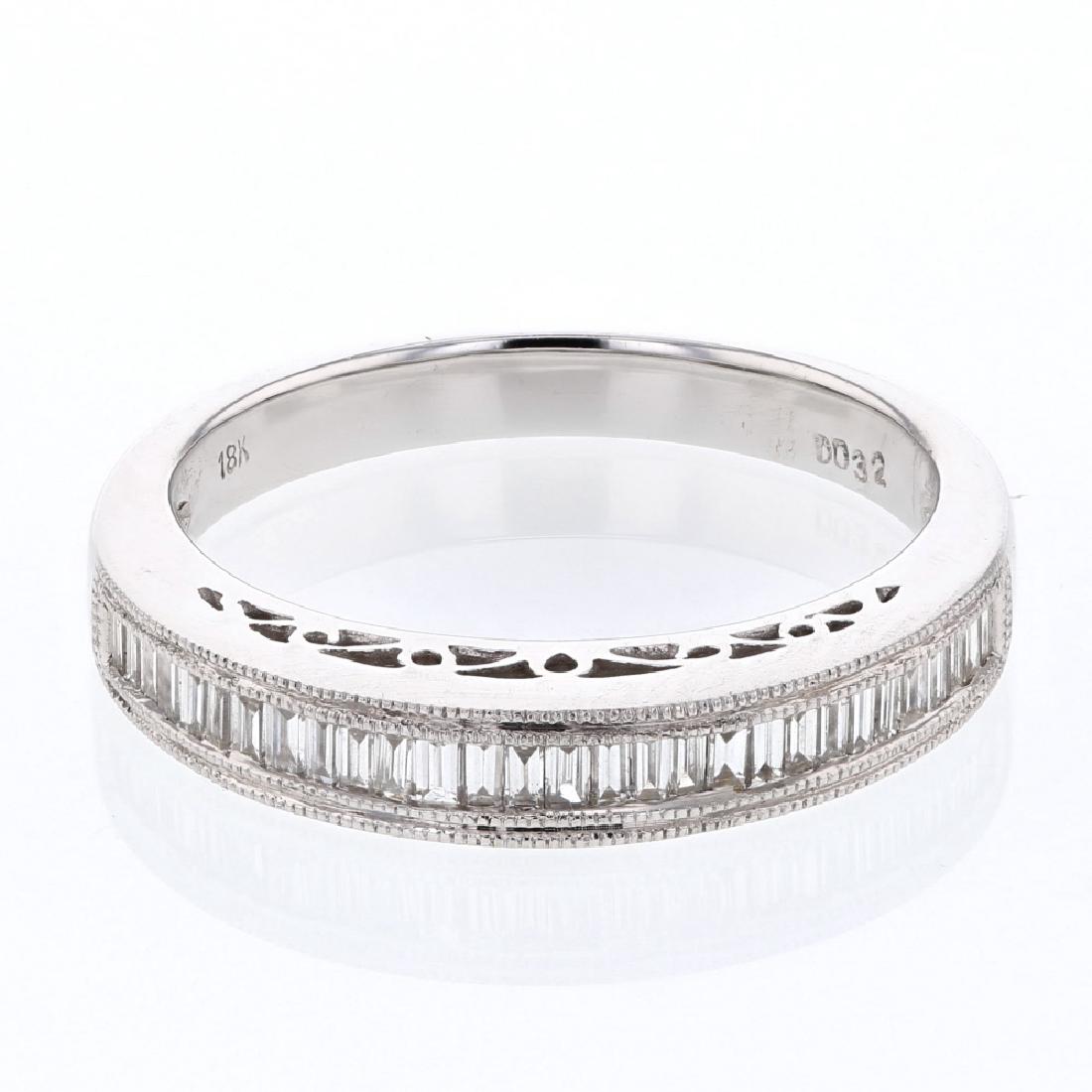18KT White Gold 0.32ctw Diamond Wedding Band: One 18KT White Gold 0.32ctw Diamond Wedding Band. (29) Baguette Diamonds with a total weight of 0.32cts with a color of G-H and clarity of SI-2. Total weight of this ring is 4.12 grams.