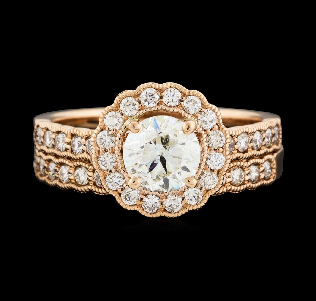 14KT Rose Gold 1.56ctw Diamond Ring: One set electronically tested 14KT rose gold lady's cast wedding ring & wedding band with a scalloped basket halo with a bright polish with milgrain detailing finish. The featured lady's wedding ring
