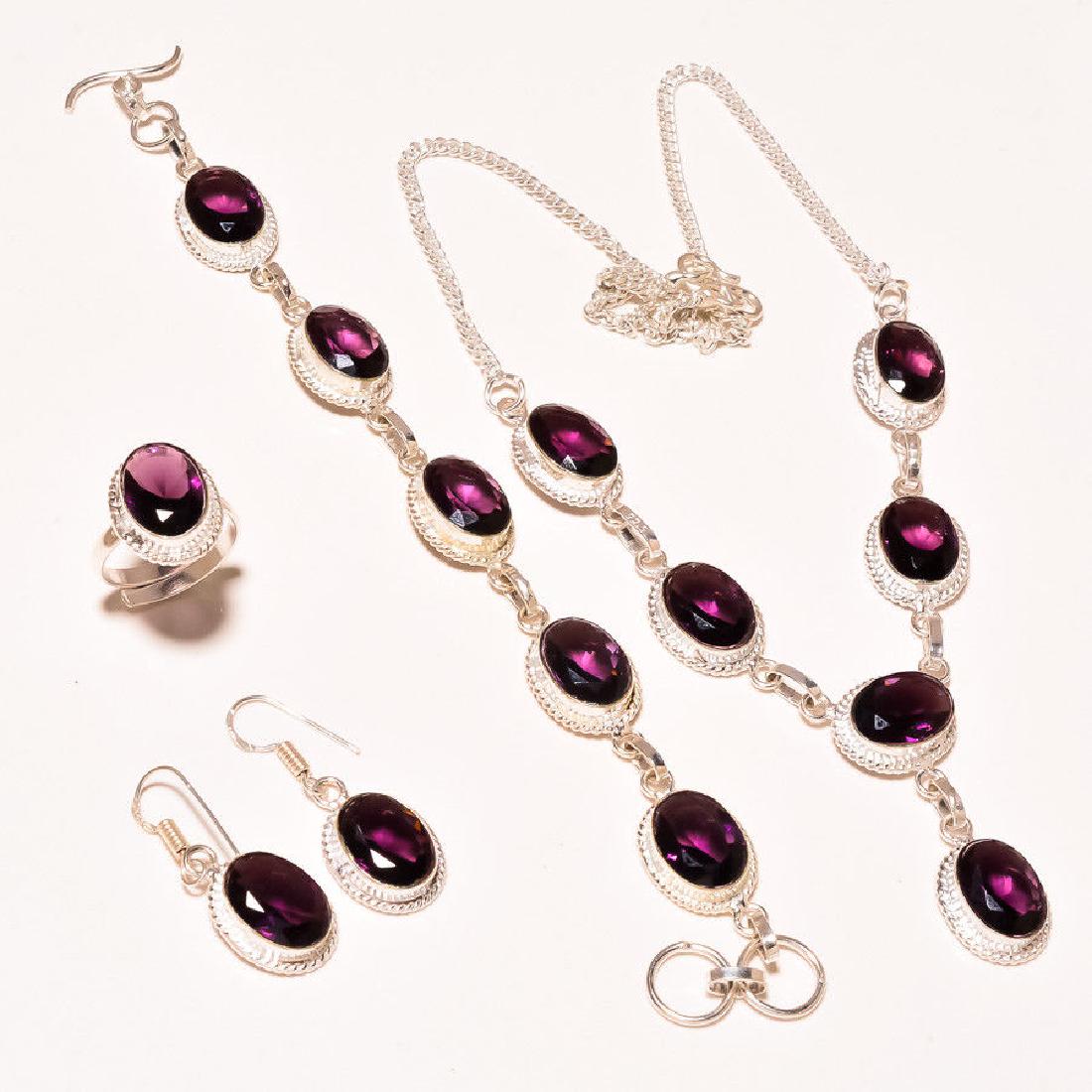 Pink To Blue 4 Piece Alexandrite Jewelry Set: Amazing pink to blue 4 piece alexandrite jewelry set. These lab made gemstones are near flawless. They burst out with a dazzling sparkle and vivid even tone . The 4 piece set includes an 18 inch neckl
