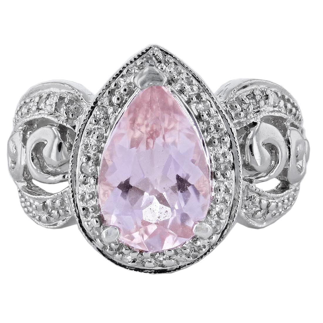 14KT White Gold 3.20ct Morganite and Diamond Ring: One 14KT White Gold 3.20ct Morganite and Diamond Ring. One electronically tested 14KT white gold ladies cast morganite & diamond ring. The featured morganite is set within a diamond bezel, supported b