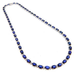 14KT White Gold 29.36ctw Sapphire and Diamond Necklace: One 14KT White Gold 29.36ctw Sapphire and Diamond Necklace. (51) Sapphires with a total weight of 29.36cts. (51) diamonds with a total weight of 1.37cts. Total weight of this necklace is 26.4 grams.