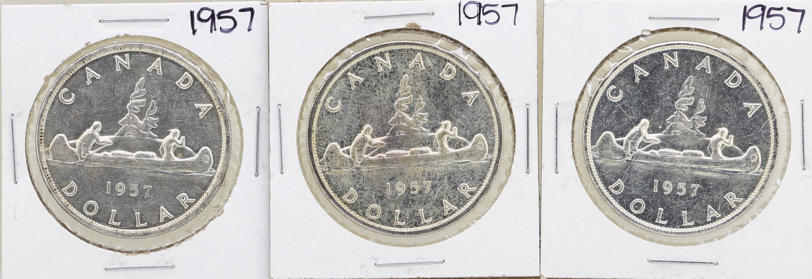 Lot of (3) 1957 $1 Canada Silver Dollar Coins: One Lot of (3) 1957 $1 Canada Silver Dollar Coins.