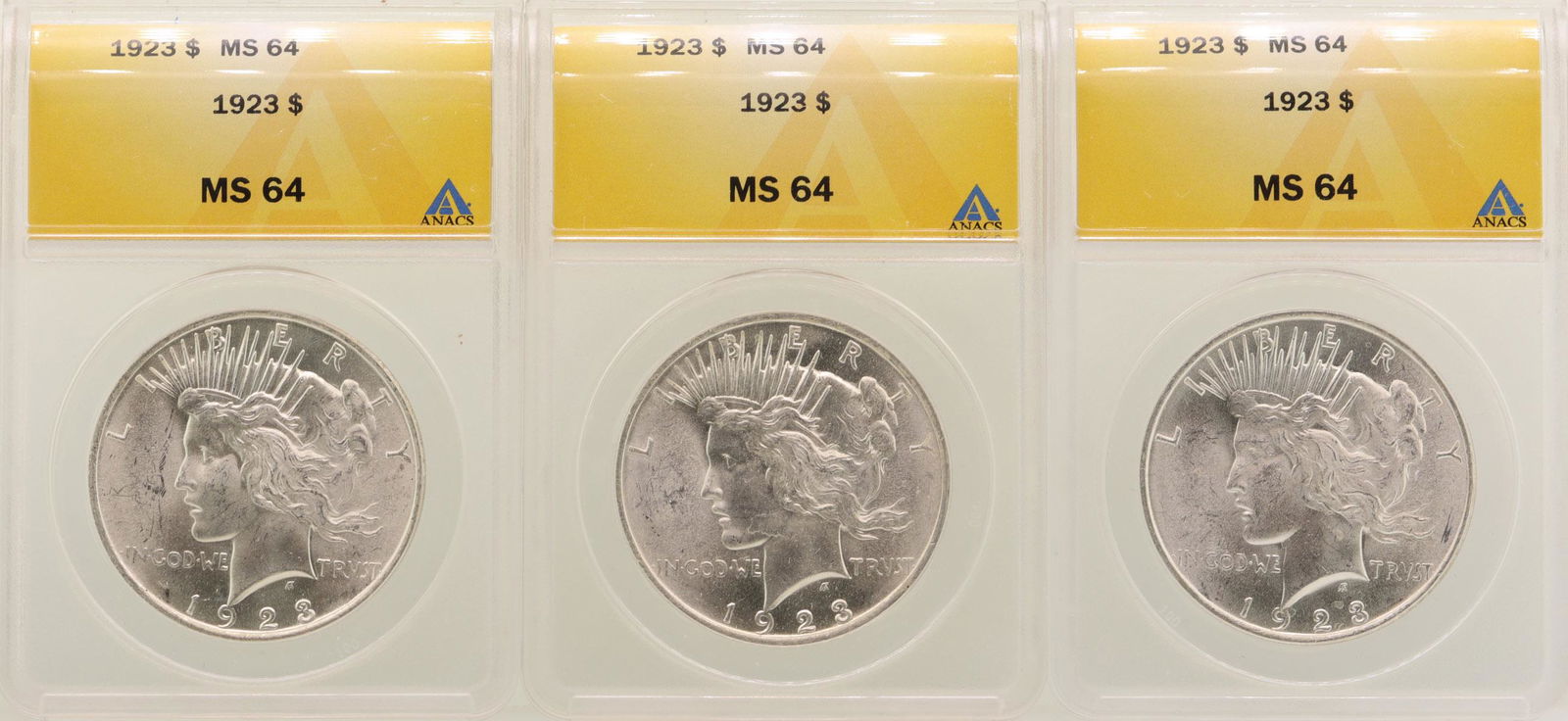 Lot of (3) 1923 $1 Peace Silver Dollar Coins ANACS MS64: One Lot of (3) 1923 $1 Peace Silver Dollar Coins ANACS MS64.