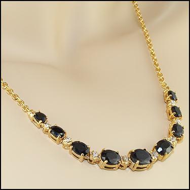 Plated 18KT Yellow Gold 5.85ctw Black Sapphire and: One Plated 18KT Yellow Gold 5.85ctw Black Sapphire and Diamond Pendant with Chain. (9) Black Sapphires measuring 1.8x2.2mm. (8) round Diamonds measuring 1.0mm with I2 clarity. 6.82 grams of brass laye