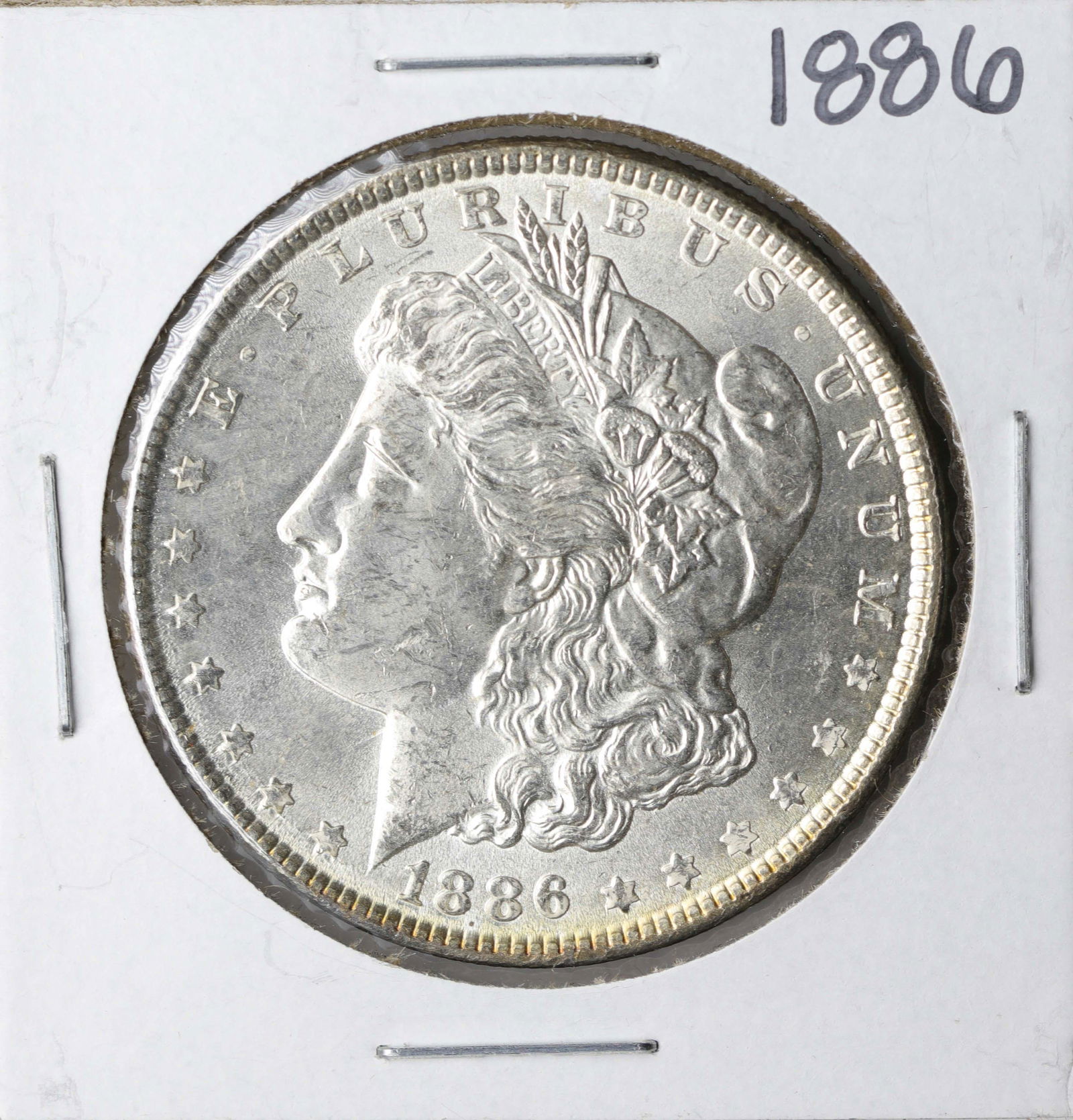 1886 $1 Morgan Silver Dollar Coin: One 1886 $1 Morgan Silver Dollar Coin.