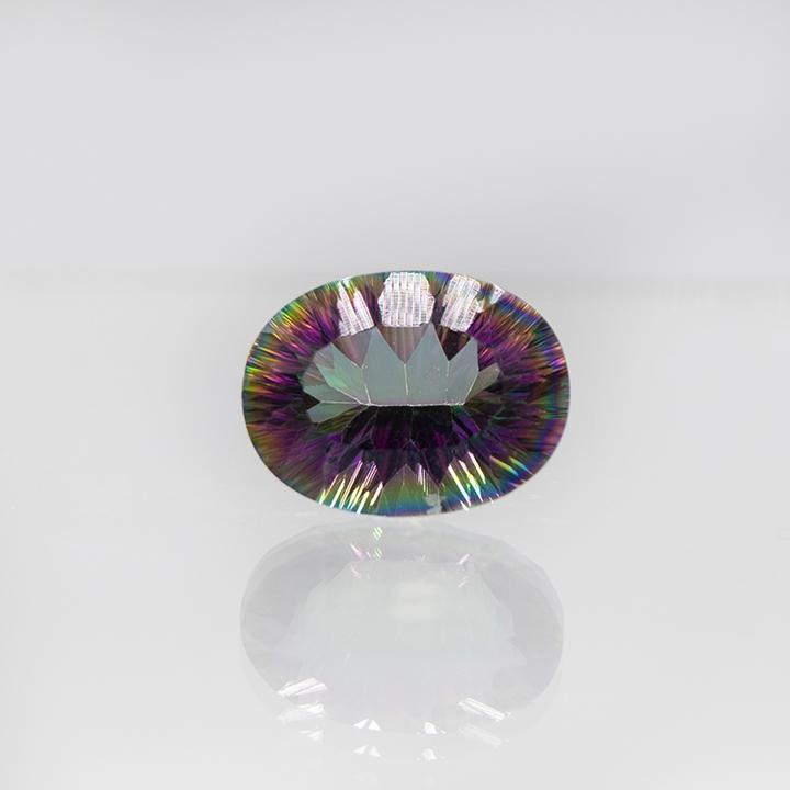Gorgeous 8.62ct Certified Mystic Topaz Solitaire: Gorgeous 8.62 Ct Certified Mystic Topaz Solitaire. Fancy concave oval cut measuring 16 x 12 mm.This mystic topaz is VVS1 rated and includes certification card.