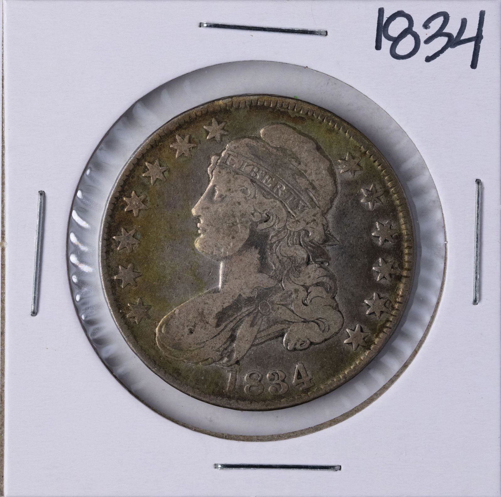 1834 Capped Bust Half Dollar Coin: One 1834 Capped Bust Half Dollar Coin.