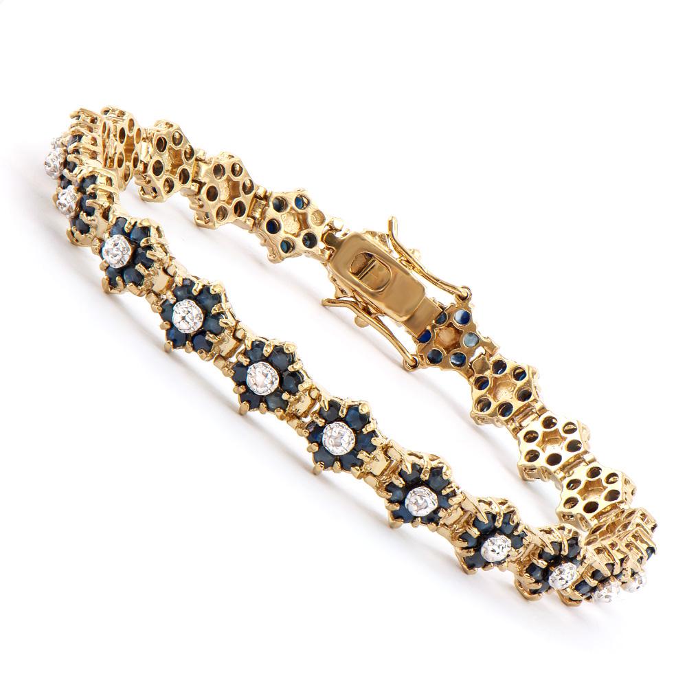 Plated 18KT Yellow Gold 6.55ctw Black Sapphire and: One Plated 18KT Yellow Gold 6.55ctw Black Sapphire and Diamond Bracelet. (132) Black Sapphires with a total weight of 6.55cts. Diamonds with a total weight of 0.16cts with a color of I-J and with a cl