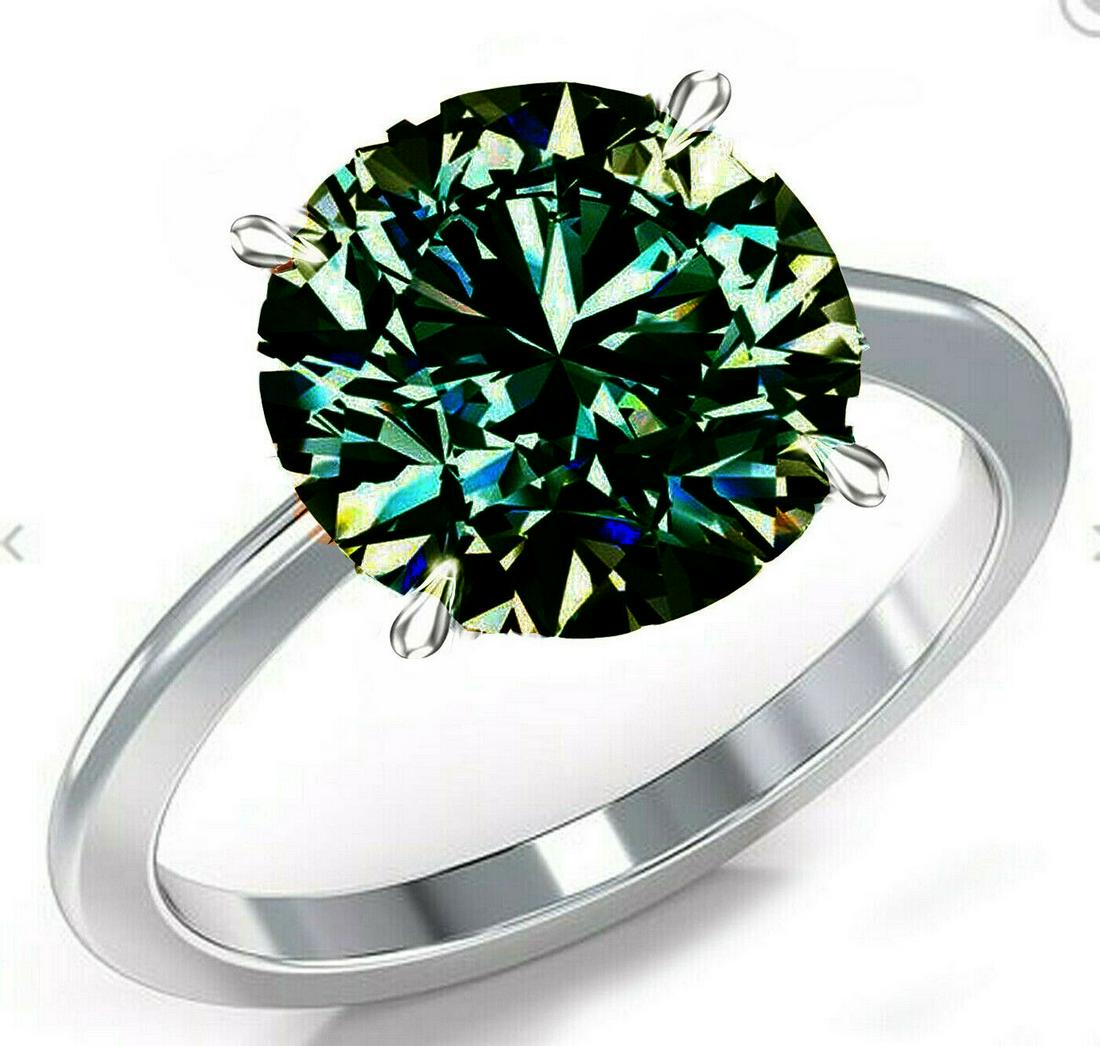Rare 5.25 Ct Forrest Green Moissanite Ring: This Huge 5.25 Ct VVs1 Brilliant Round Cut is Eye Clean and Measures 10.75 mm. It has amazing sparkle and radiance bursting out with electric flashes of color. This high quality moissanite is mounted 