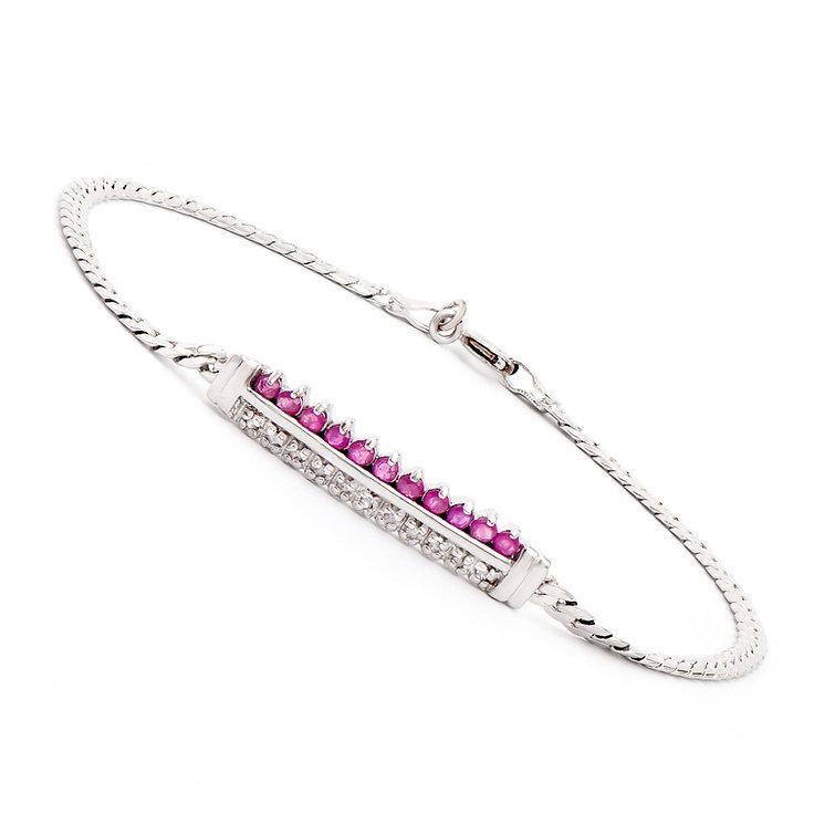 Plated Rhodium 0.6cts Ruby and Diamond Bracelet: One Plated 0.6 TWcts Ruby and Diamonds Rhodium Bracelet. (11) Red Ruby stones with a total weight of 0.51cts. (11) diamonds with a total of 0.09cts with a color of H-I and clarity of I-3. Total weight