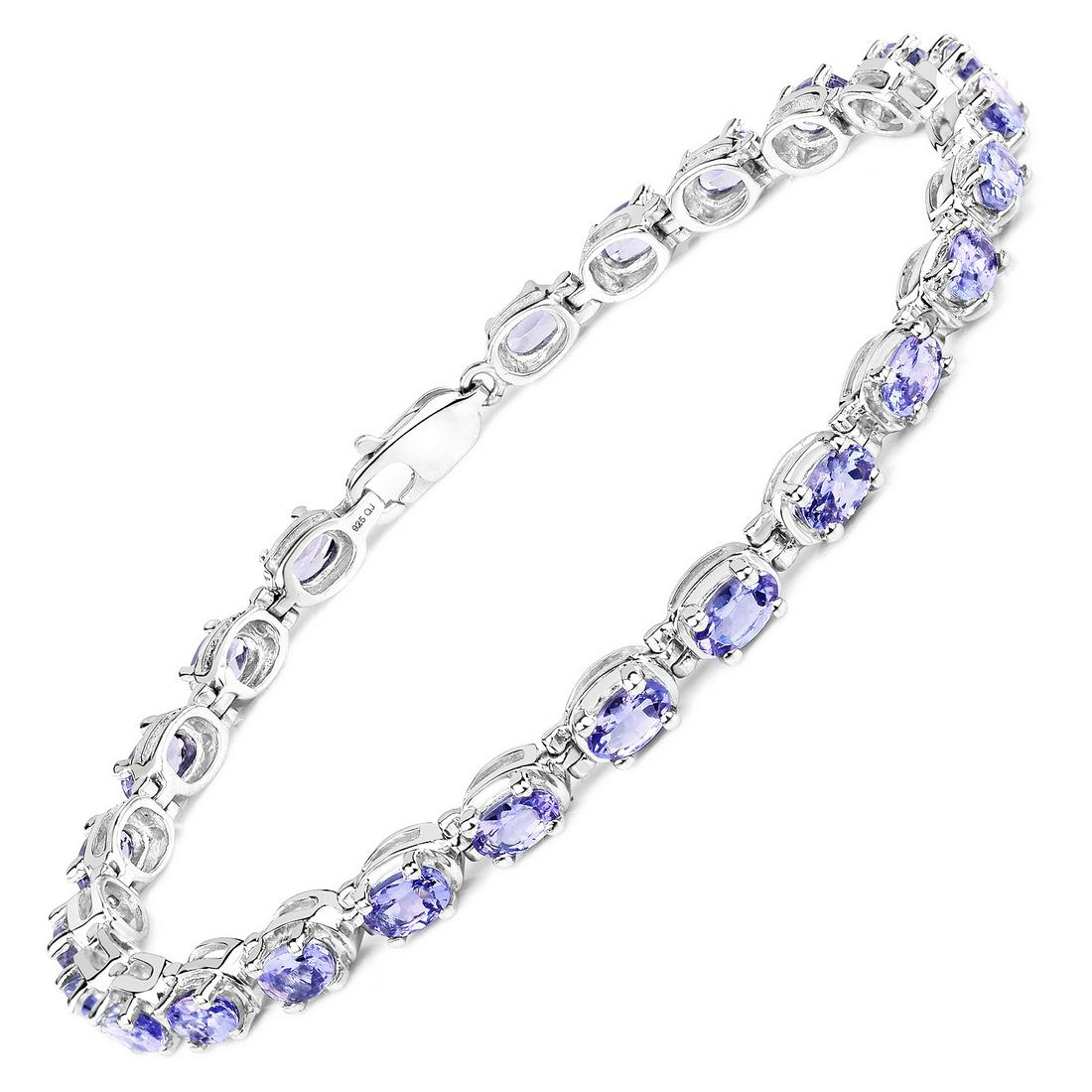 Rhodium Plated 6.00ctw Tanzanite Bracelet: 6.00 Carat Genuine Tanzanite.925 Sterling Silver Bracelet.Tanzanite Oval/5x3mm - 25/6.00 ctw Prong Setting Natural Heat Treated E. Total weight 9 grams. Bracelet length is 7 inches.