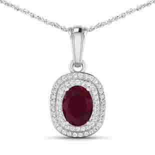 14KT White Gold 1.5ct Ruby and Diamond Pendant with Chain: (1) Oval Ruby with a total weight of 1.50cts. (58) round Diamonds with a total weight of 0.26cts with a color of (i) and a clarity of i1-i2. Total weight of this pendant with chain is 2.97 grams. 16 i