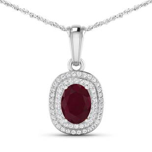 14KT White Gold 1.5ct Ruby and Diamond Pendant with Chain: (1) Oval Ruby with a total weight of 1.50cts. (58) round Diamonds with a total weight of 0.26cts with a color of (i) and a clarity of i1-i2. Total weight of this pendant with chain is 2.97 grams. 16 i