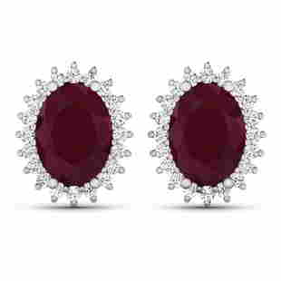 14KT White Gold 3.00ctw Ruby and Diamond Earrings: (2) Rubies with a total weight of 3.00cts. (40) round Diamonds with a total weight of 0.26cts with a color of i and clarity of i1-i2. Total weight of these earrings are 2.95 grams.