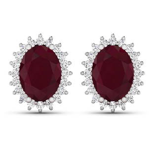 14KT White Gold 3.00ctw Ruby and Diamond Earrings: (2) Rubies with a total weight of 3.00cts. (40) round Diamonds with a total weight of 0.26cts with a color of i and clarity of i1-i2. Total weight of these earrings are 2.95 grams.
