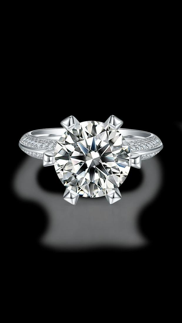 Sparkling 5 Ct VVS1 White F-G Fire Moissanite Ring: This Fire Moissanite is a VVS1 Brilliant Round Cut. The Color is F-G with a clarity of VVS-1. Measuring approx.10.5 mm. This Fire Moissanite is near flawless and bursting out with a full spectrum of c