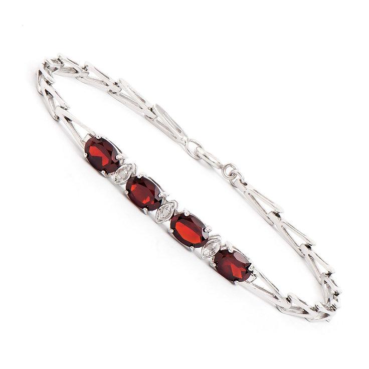 Plated Rhodium 3.35cts Garnet and Diamond Bracelet: One Plated 3.35cts Garnet and Diamond Rhodium Bracelet 7.5 in. (4) Brown Garnet stones with a total weight of 3.32cts. (3) diamonds with a total of 0.03cts with a color of H-I and clarity of I-3. Tota